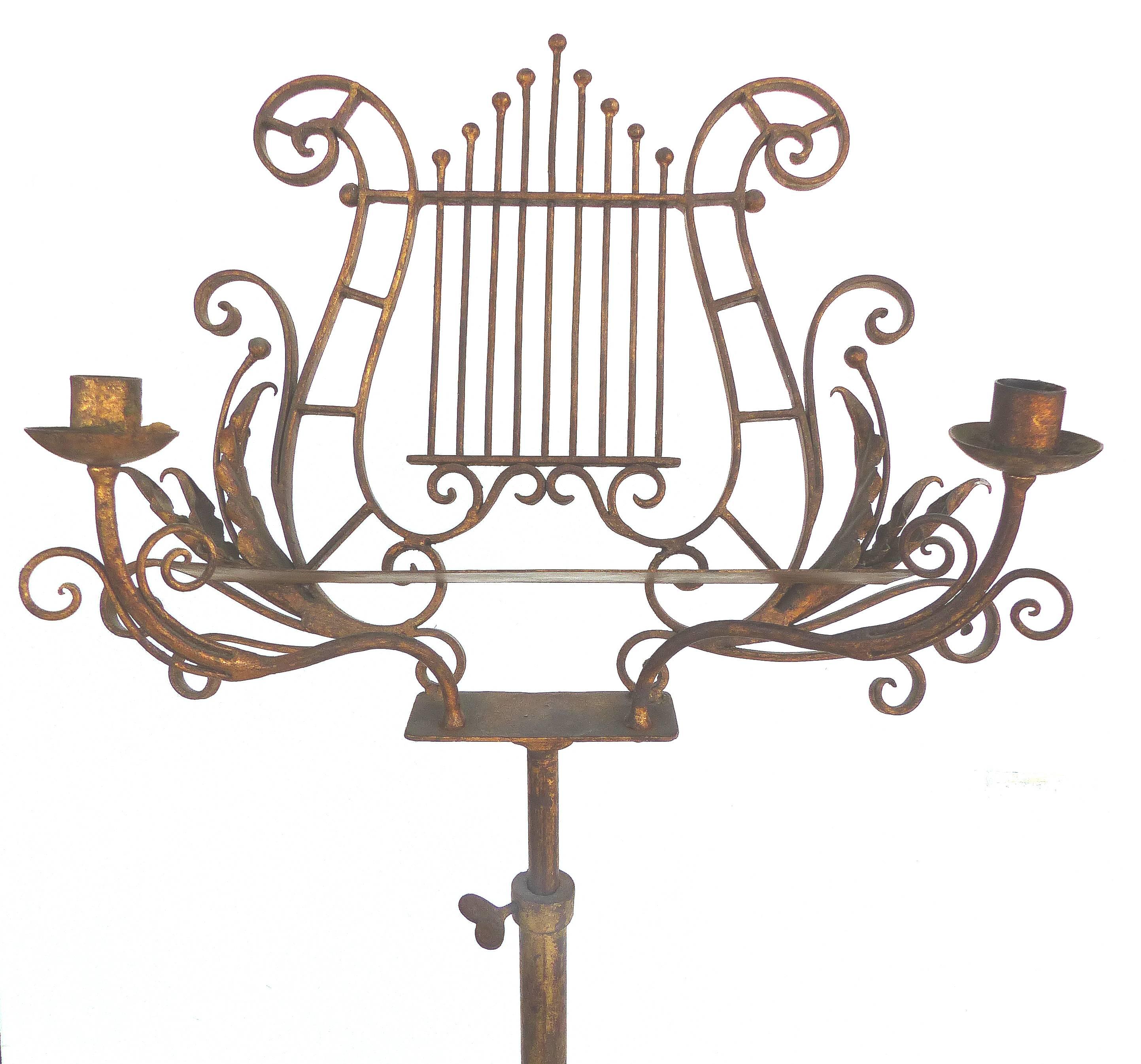 Offered is an adjustable gilt iron music stand having a lyre shaped pedestal base. This piece is from a prominent Coconut Grove, Florida estate of the Lily pharmaceutical family which was designed by Paul Chaflin, the same designer as the Vizcaya