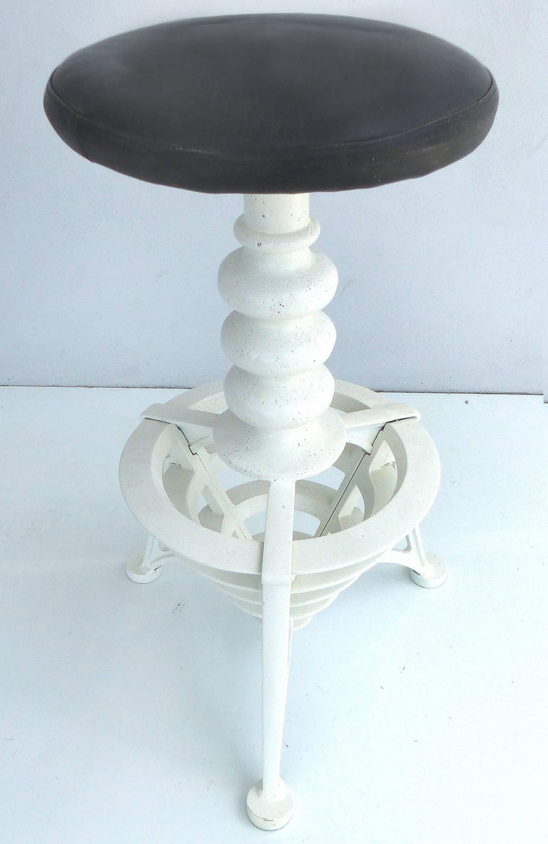 Turn of the Last Century Cast Iron Swivel Bar Stools with Leather Seats, Pair For Sale at 1stDibs