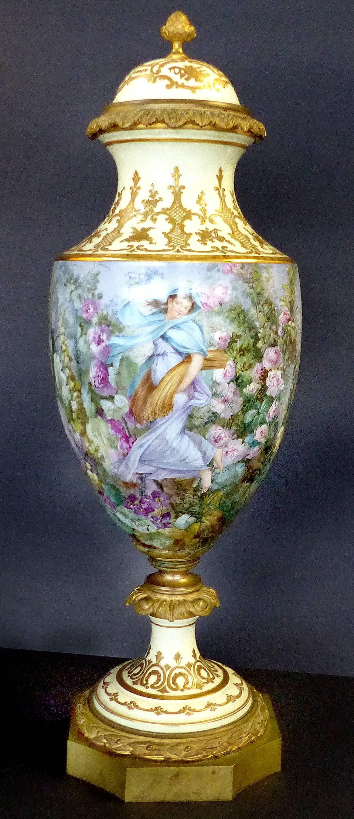 19th Century Hand-Painted Sevres Covered Urn Mounted in Gilt Bronze, Signed

Offered is a fine Sevres hand-painted covered urn signed L. Pater. This gilt bronze mounted covered porcelain urn in three parts, beautifully painted with a harvest scene