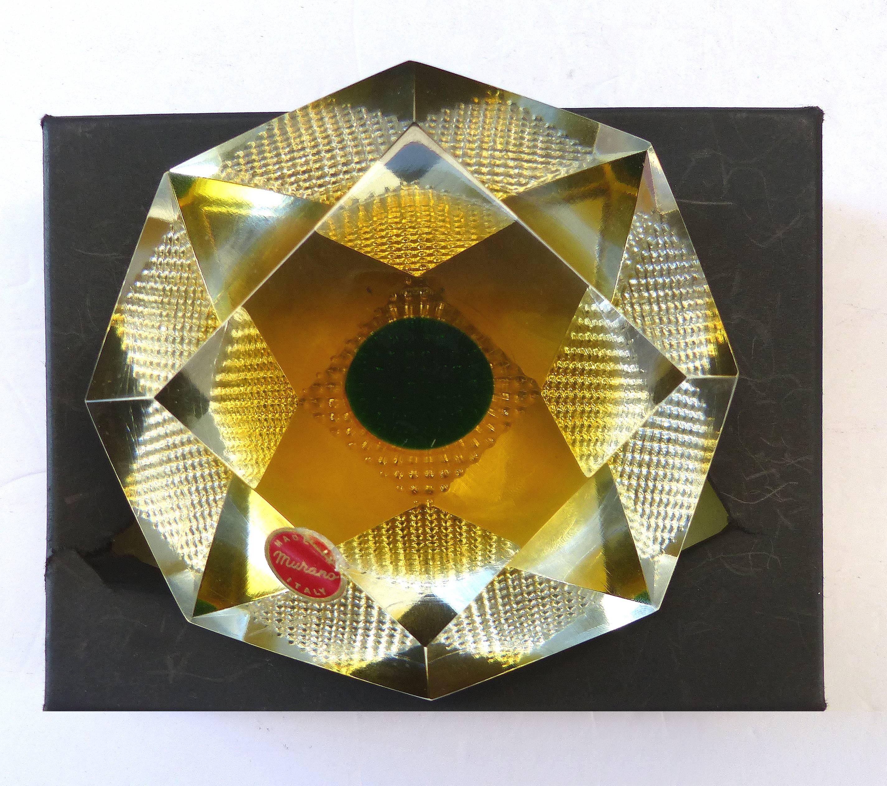 Murano Glass Brilliant-Cut Diamond Form Object D'art Paperweight in Box

Offered for sale is a brilliant-cut diamond form Murano glass paperweight. The glass object d'art retains the original Murano Sticker and includes the original box. Originally