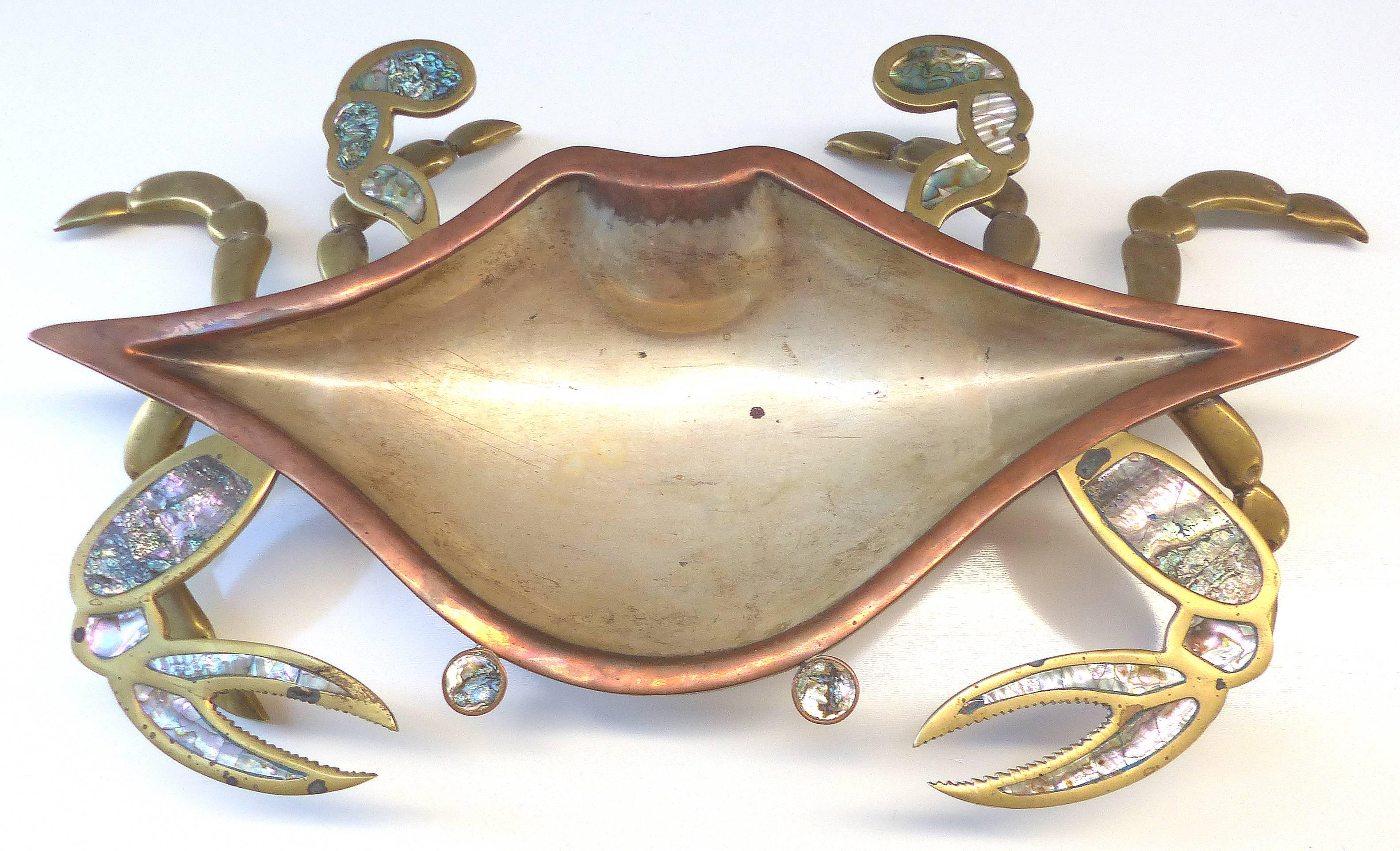 Monumental Los Castillos Style Abalone Metal Crab Bowl with Two Side Dishes

Offered for sale is a rare three piece set of copper and brass crab serving pieces inset with abalone from Tlaquepaque FCS Cobre Mexico. There are two smaller crabs and one