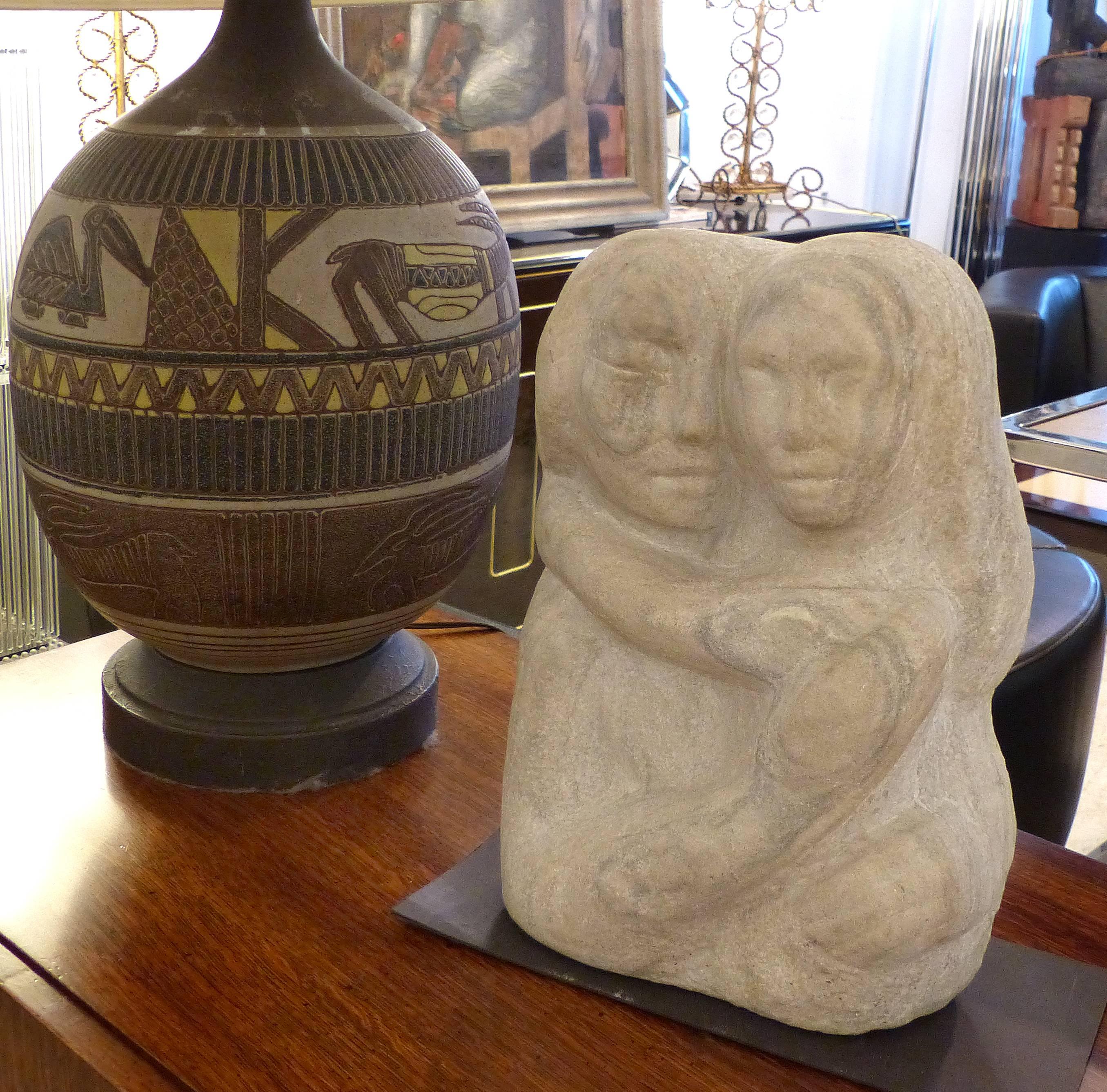 Offered for sale is a Mid-Century Modern carved limestone sculpture by Florence Krieger (1919-2011). Florence Krieger was a listed Brooklyn artist who exhibited work in several artistic mediums. The sculpture is carved in limestone and viewed from