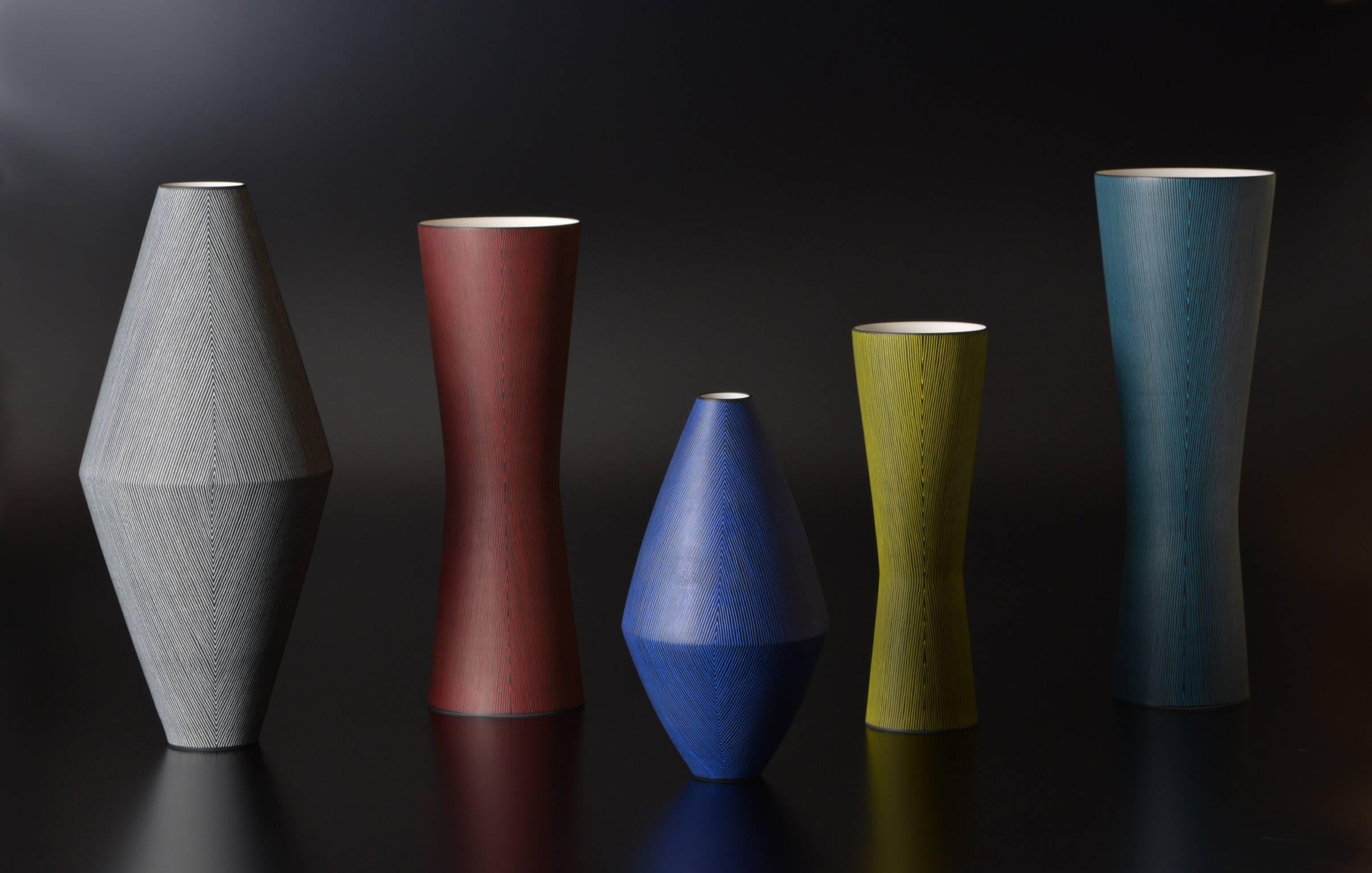 

Offered by  J R Richards
A group of five elegant porcelain vases by Contemporary Ceramic Artist Masaru Nakada (b. 1977-).
This group of vases; each with it's own form, color and style, would stand alone on its own, but to separate them from one