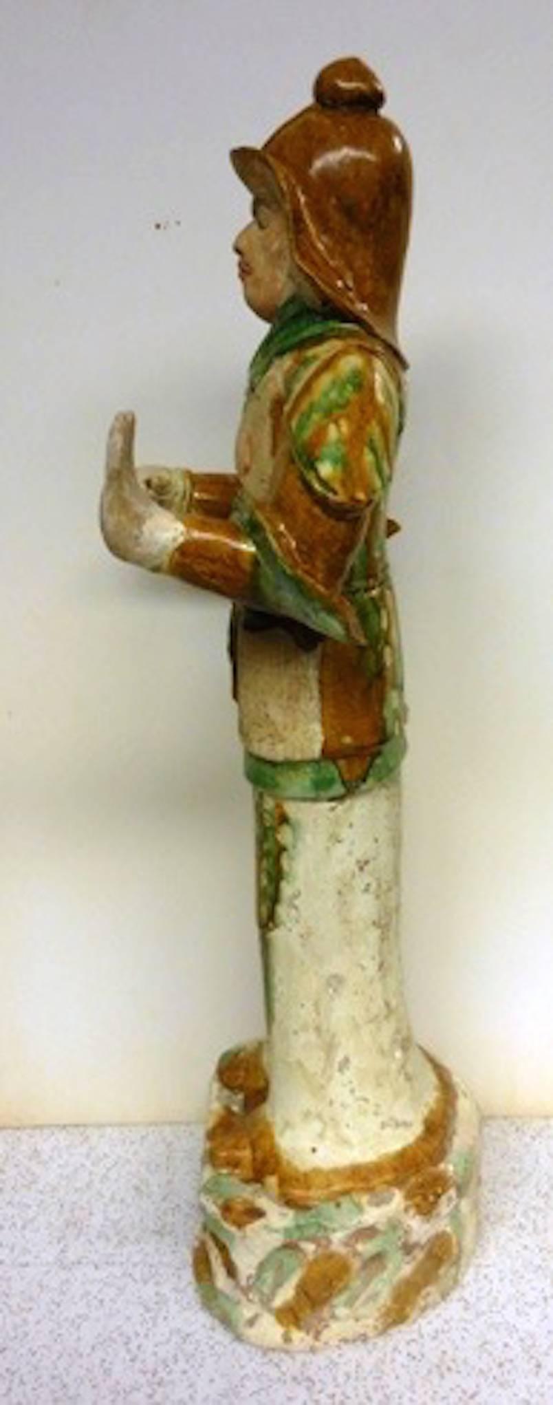 
A Tang Dynasty Guardian official with Sancai Glazes. The three colored glazed figures are prized objects, and only the very top officials of the Tang Dynasty were given access and privilege to have these made.
The figure is dressed in body armour