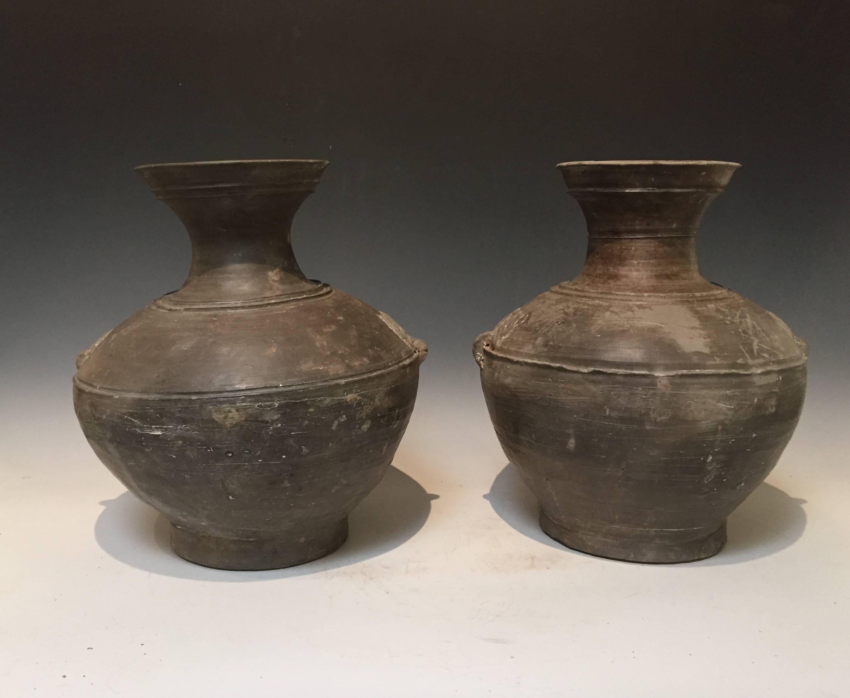 Offered by J R Richards
Pair of Han Dynasty Grey Pottery Jars. 14