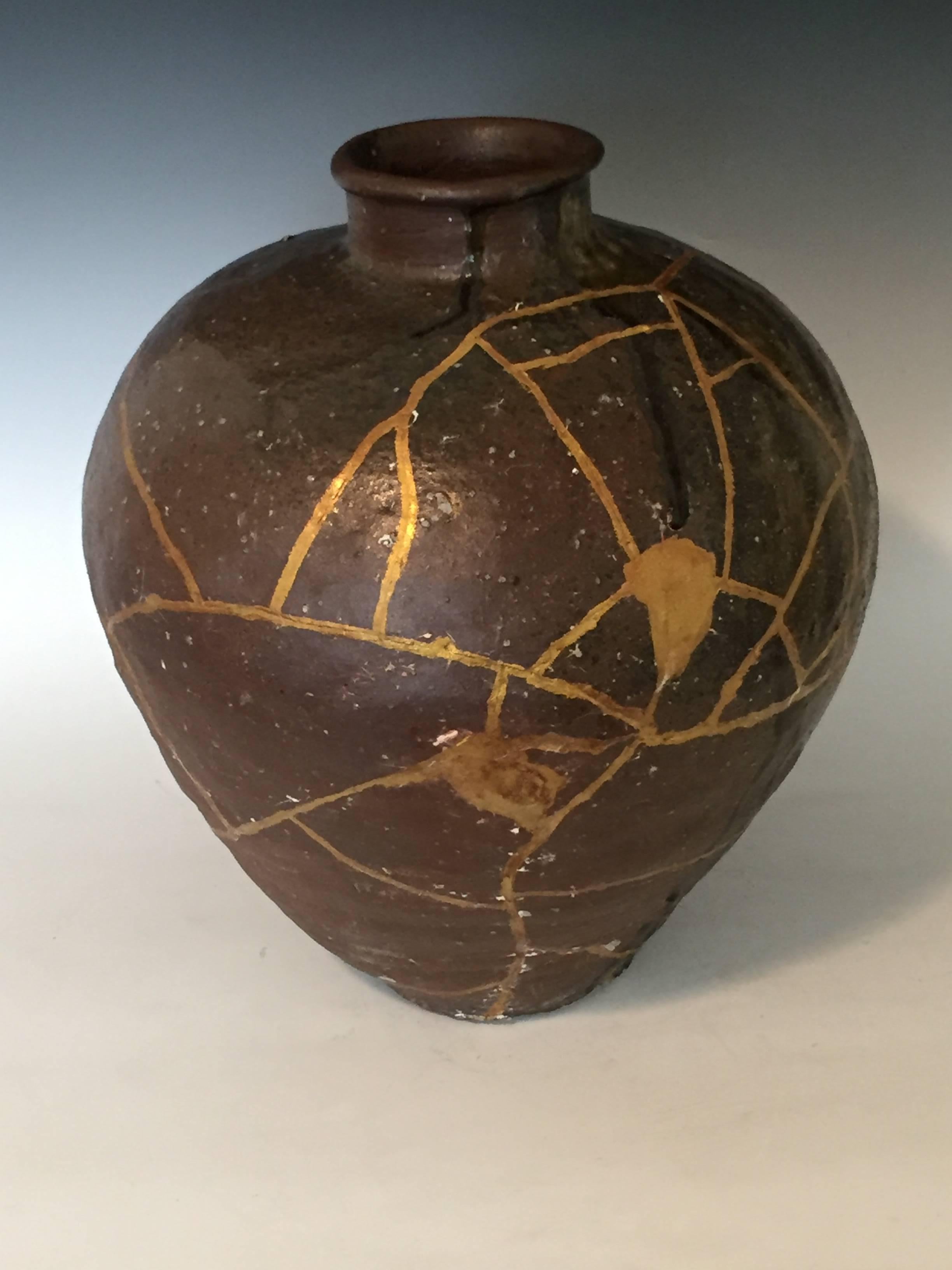 16th century Shigaraki jar with natural ash glaze. Produced during the Muromachi Period (1228-1573).
The surface is distinguished by the red, orange and green ash glazes. The core is red brick and contains many small stones. The embedded granules