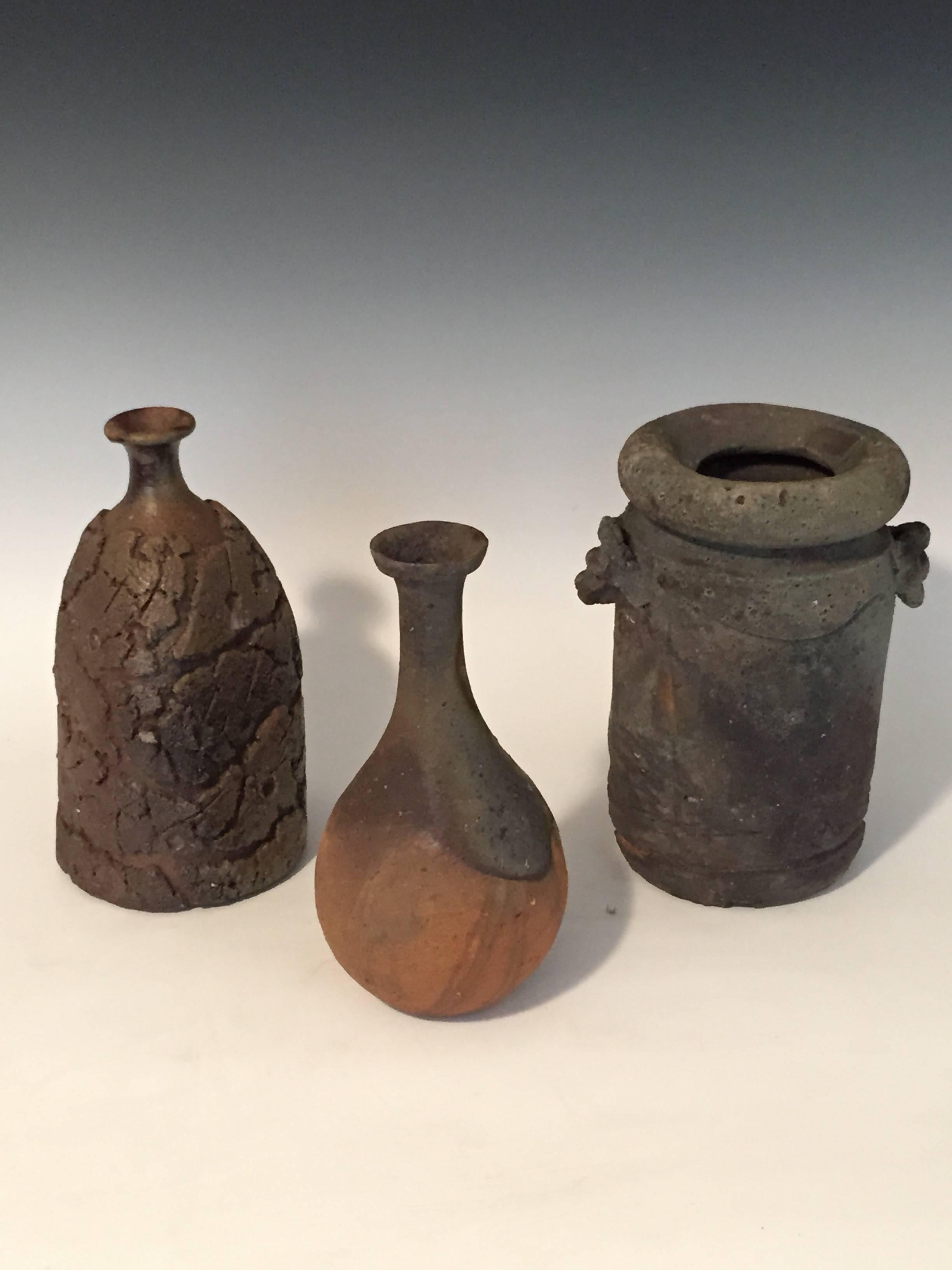 Three beautiful handcrafted ceramic vases by well respected Japanese potter Harada Shuroku (b.1941 - ).
The wood firing results in bringing out the organic color effects that are the gift of the unknown.
All three pieces come with individual