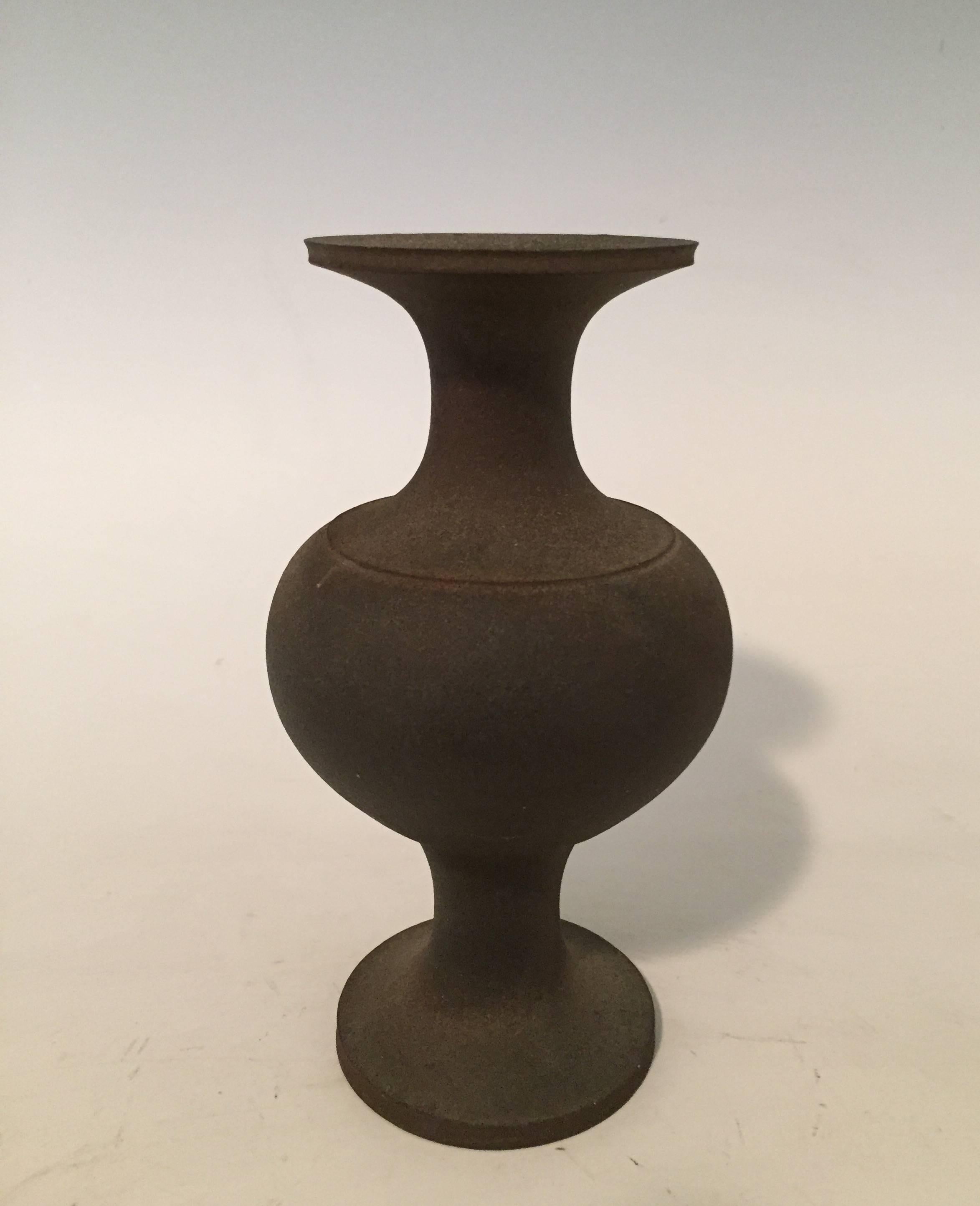 A one of a kind stoneware vase by Japanese ceramicist Koji Toda (born 1974-).
Of rounded form, this wood fired vase has a bold appearance. Inspired by bronze forms from pre 12th century water pitchers.
The beautiful sensibility of ceramics not found