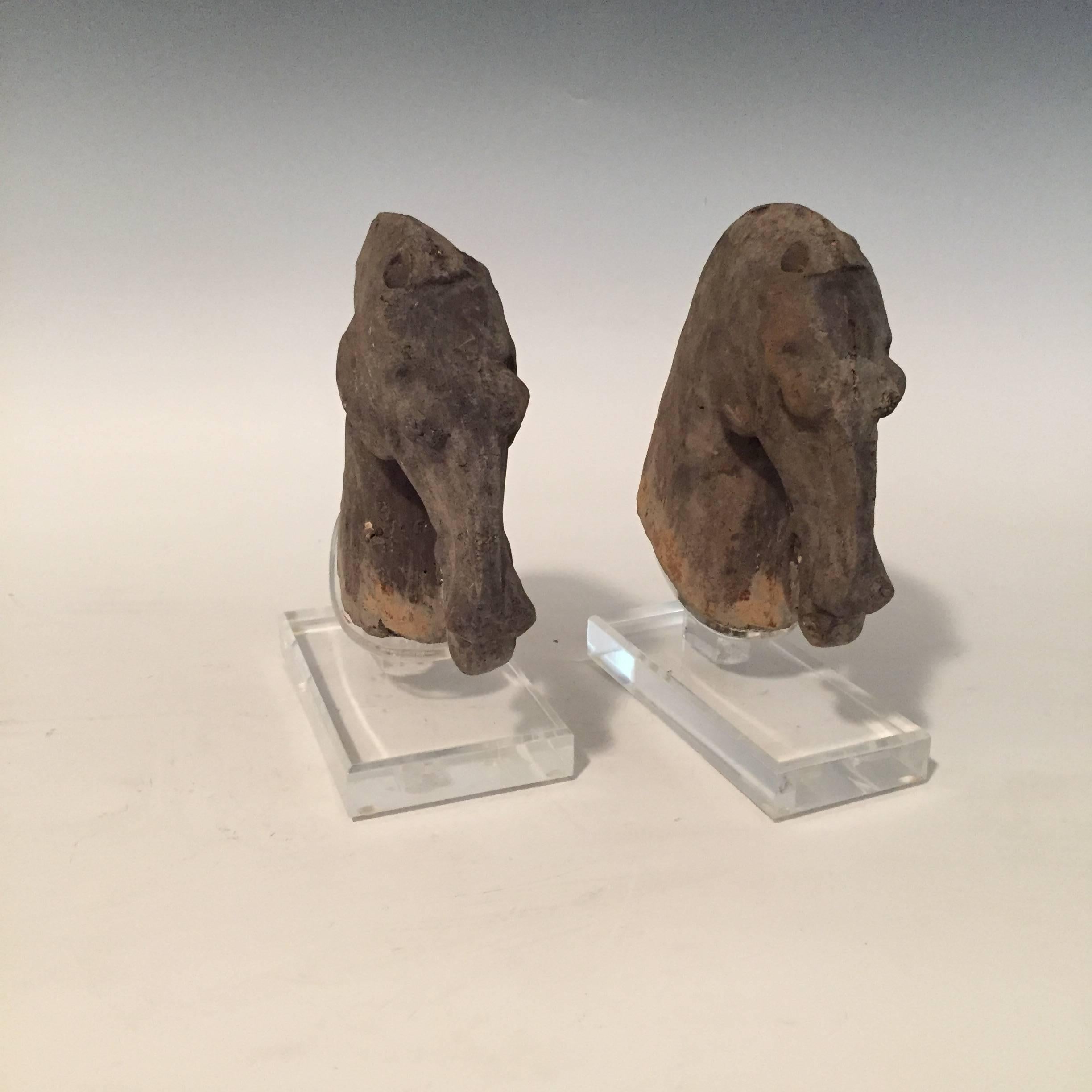 Pair of Han dynasty horse heads (206 BC-220 AD)
Grey pottery horse heads with patina. Each with strongly carved features, sitting upon clear plexiglass bases.
Measures: 8" tall x 8" length x 3.5" deep (horse head size).