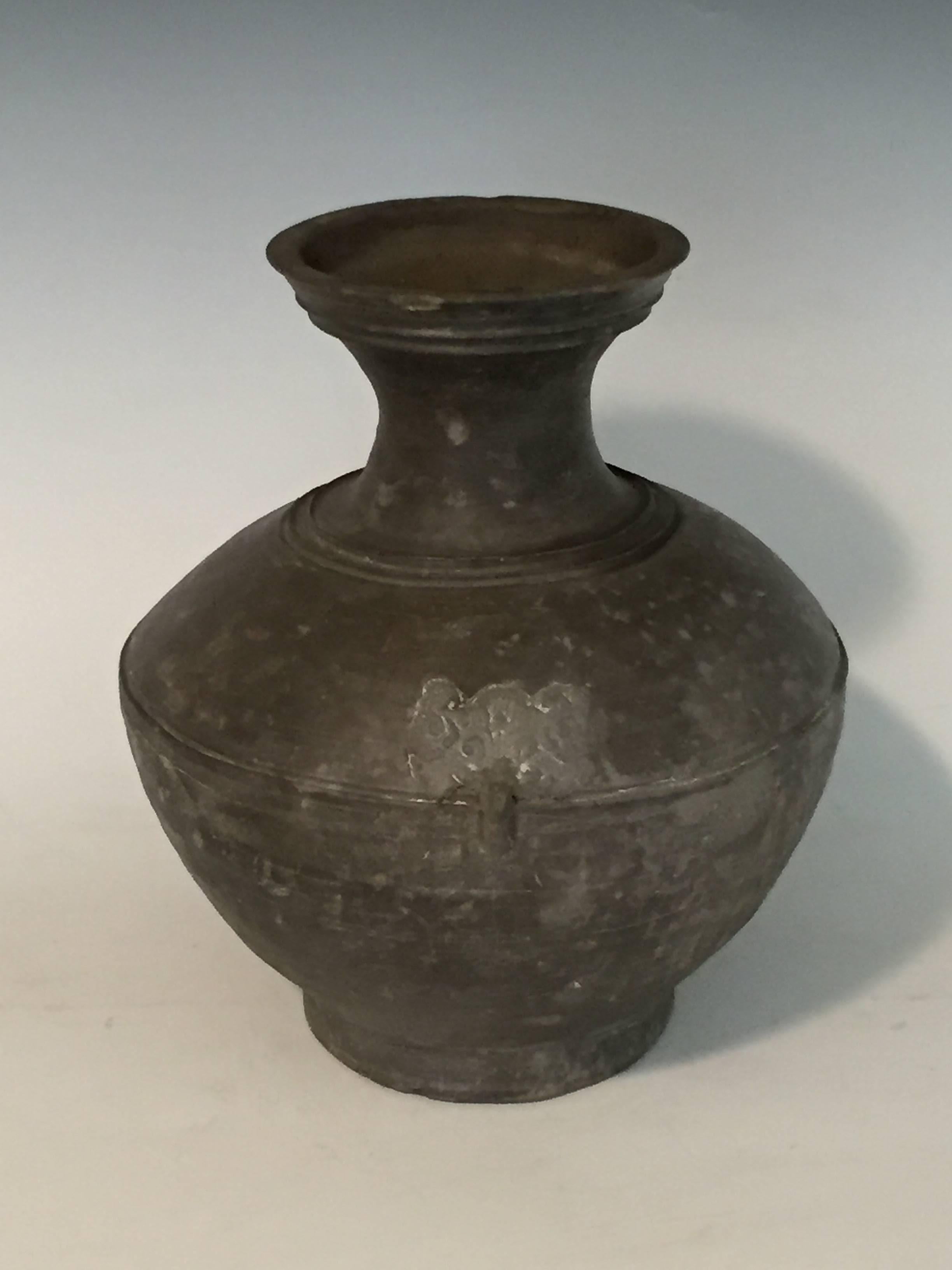 Offered by J R Richards
A set of four Han Dynasty Grey Pottery Jars ranging in size from 10 1/4