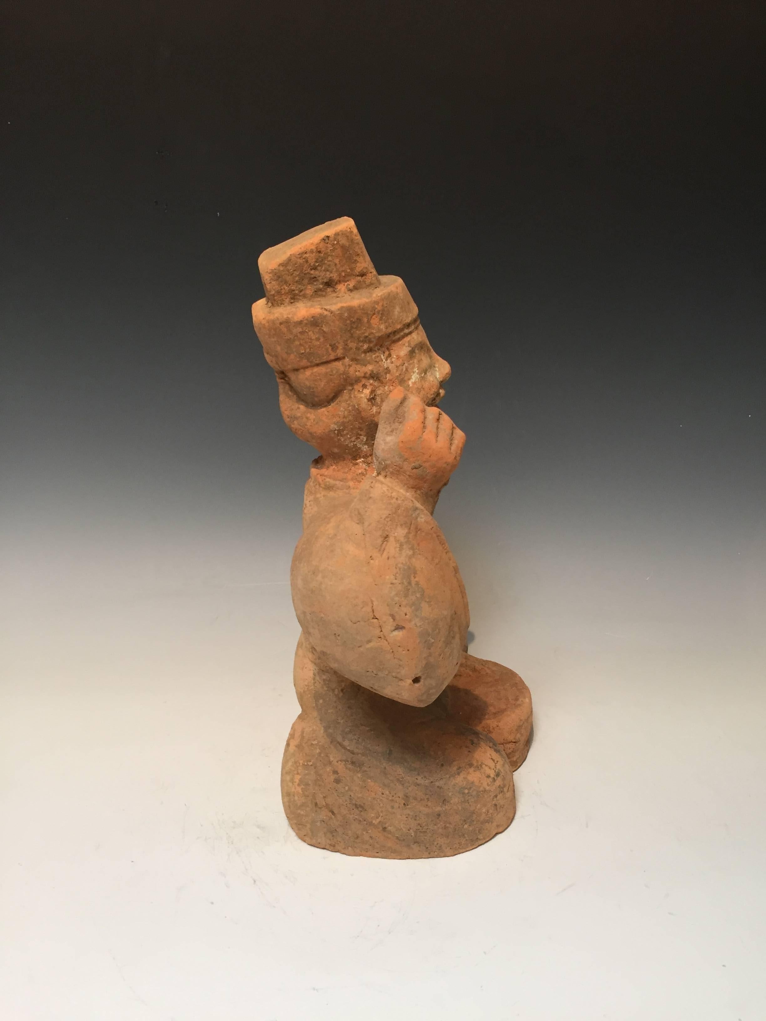 Pottery musician from the Han dynasty (Sechuan style).
Entertainers were often memorialized, ranging from dancers, drummers, story tellers, etc.
This piece depicts a lively and jovial drummer and story teller.
Measure: 16
