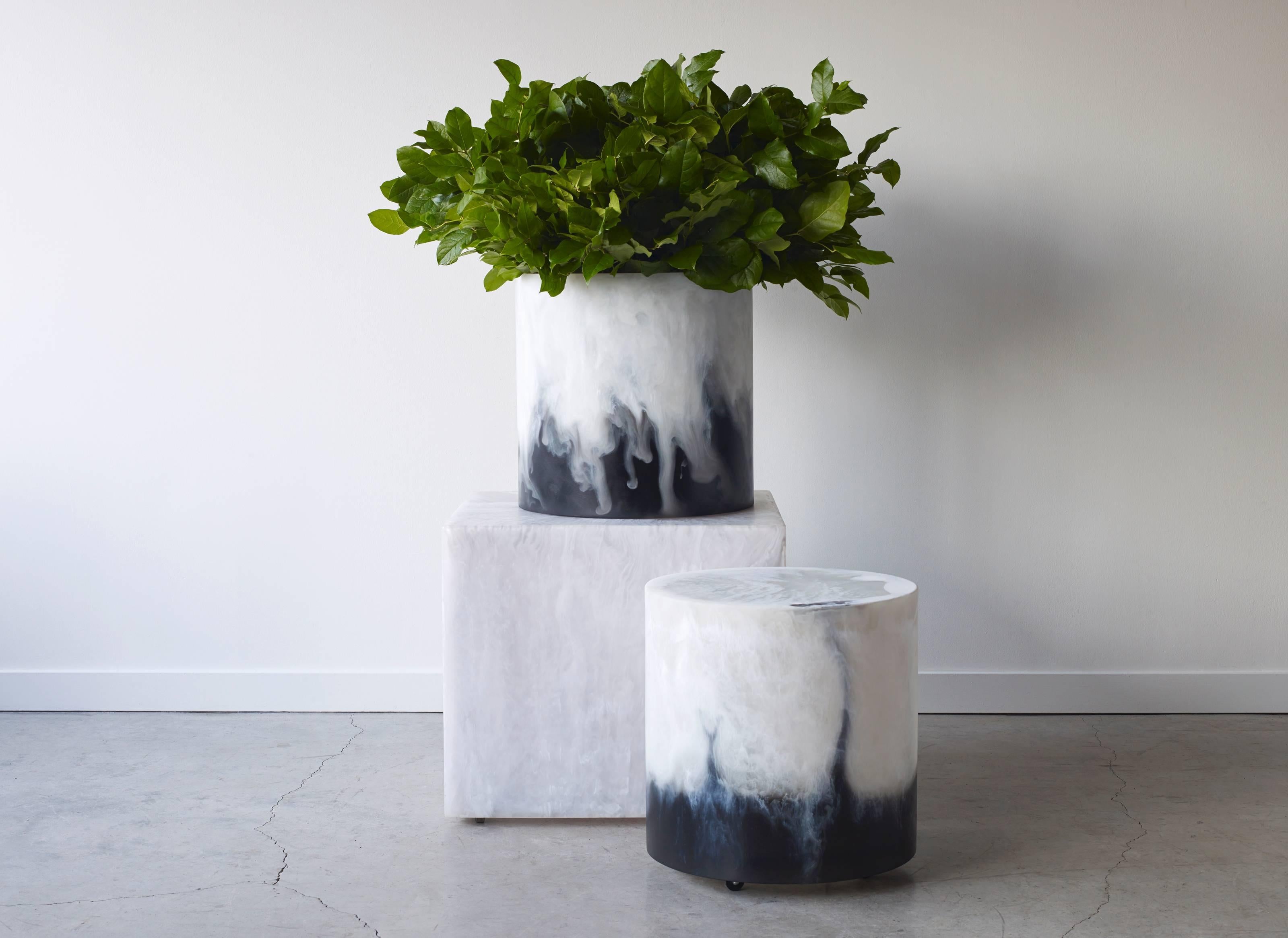 Uncomplicated, sculpture are versatile enough to complement any space. Mounted on casters, they tuck neatly under table and double as casual seating Martha Sturdy's resin table can be poured in over 40 different colors or combination of making the
