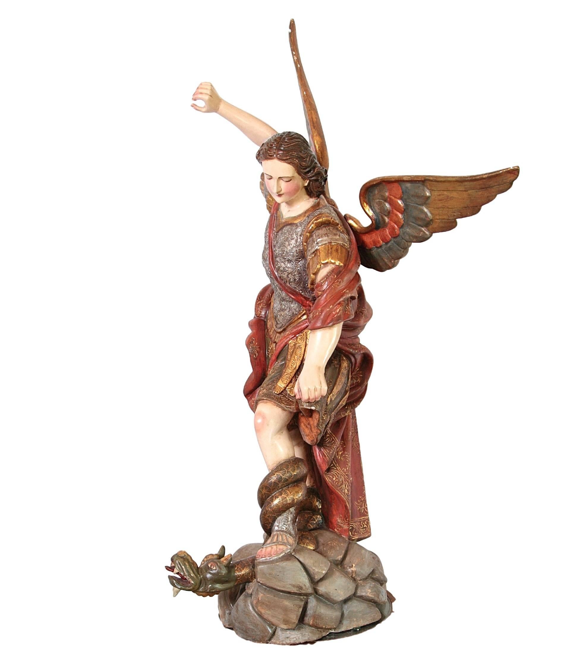 Carved Saint Michael Slaying the Dragon Statue