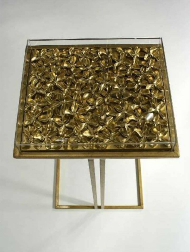 Stunning new clover cocktail table handmade by North Carolina-based artisan Tommy Mitchell. This gold metal piece has been hand-hammered and gilt-finished with a Lucite top. This table acts as both a functioning table for your home, as well as a