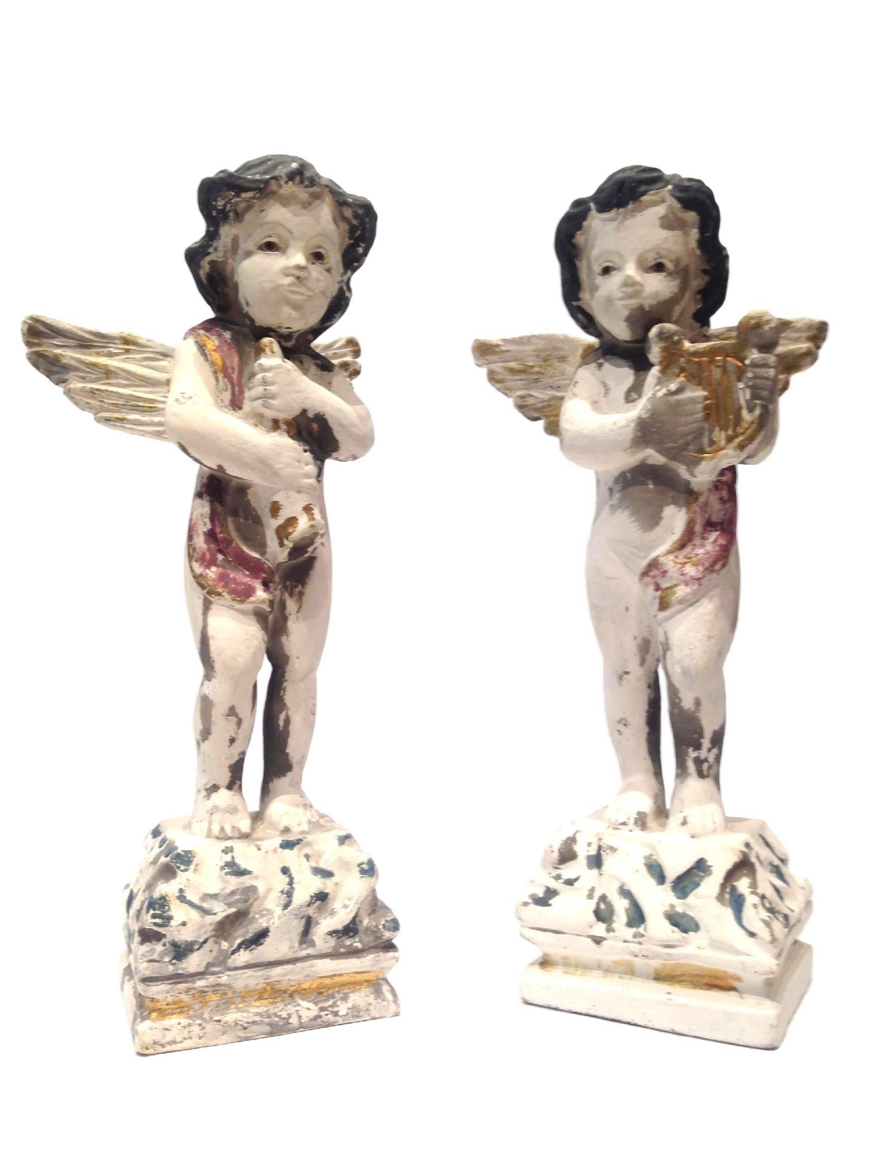 Beautiful pair of hand-painted musical cherub statues.
Measures: 10