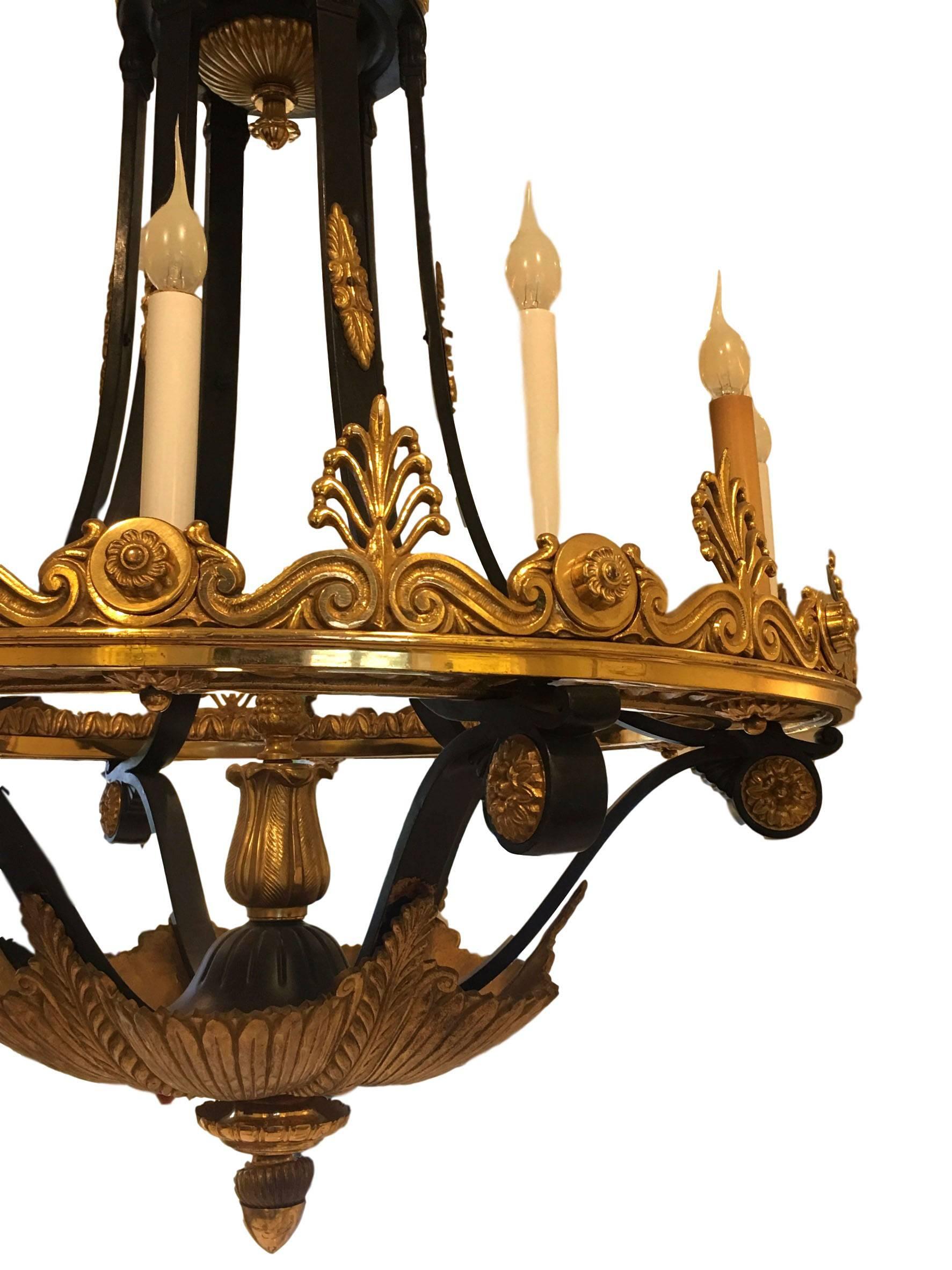 This is a very impressive 19th century bronze dore and gilded chandelier with twelve lights (1880-1990). This item is in phenomenal shape and is a stunning statement piece.

Measures: 27.5