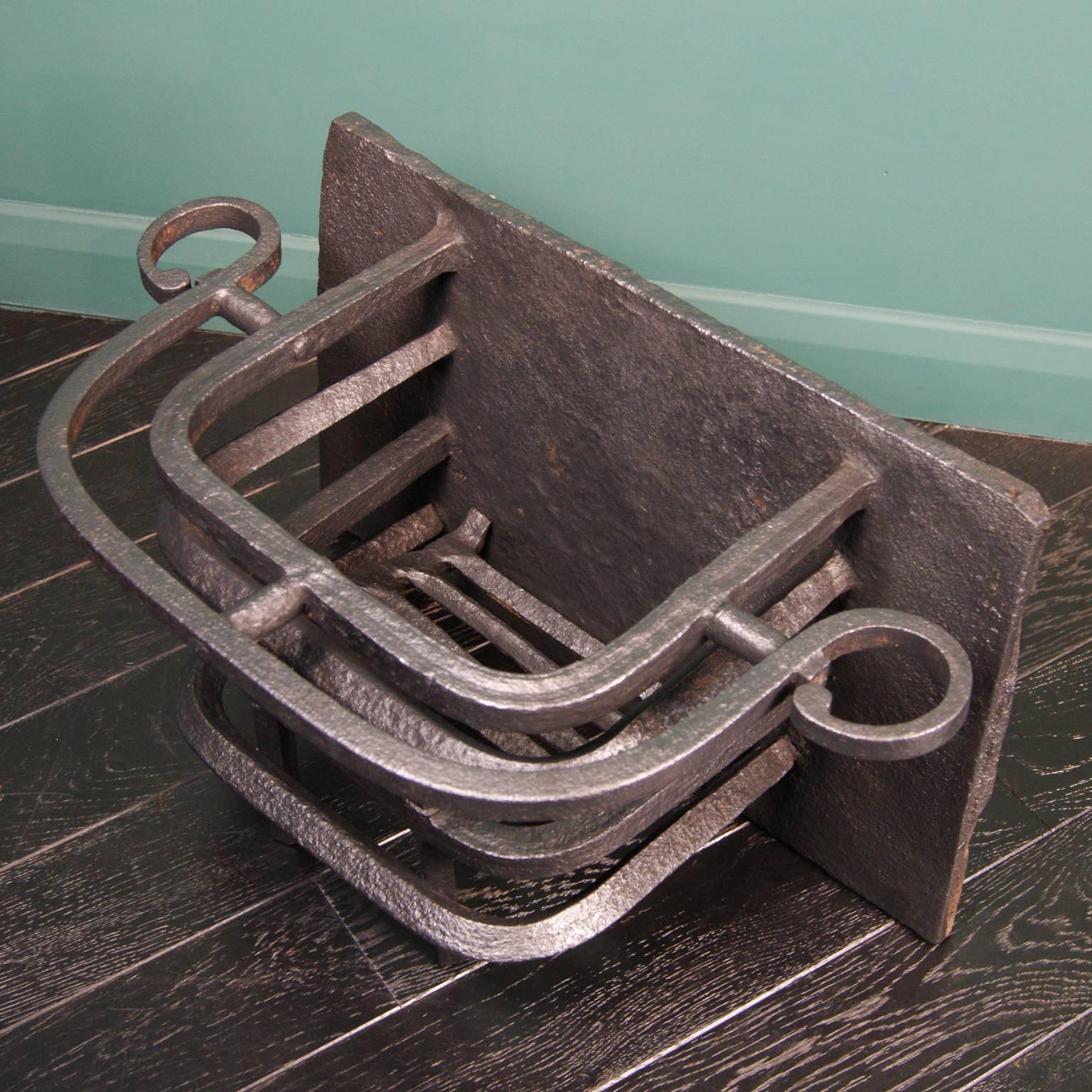 Wrought iron fire basket with scroll-detail to top fire bar, fire-welded grill and heavy gauge fireback.