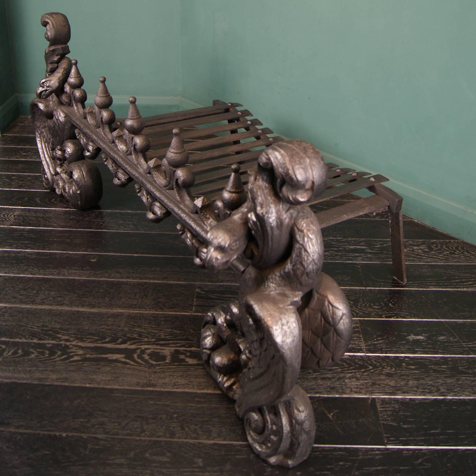 An important large cast-iron baronial grate in blackened cast-iron, the perpendicular style moulded bar with spiked decorations terminated by wrythen eagles and scroll work. Originally from a mansion in Southern Scotland.
One image shown with rear