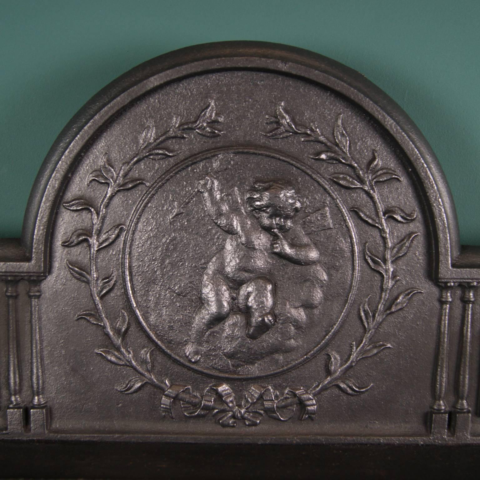 A 19th century ornate Carron Company hob grate with intricate geometric and foliage pattern to hob sides and fire bars, framed with beading detail. Cherub and wreath central motif on shaped fireback. Functioning ash pan with ring handle.
Fully