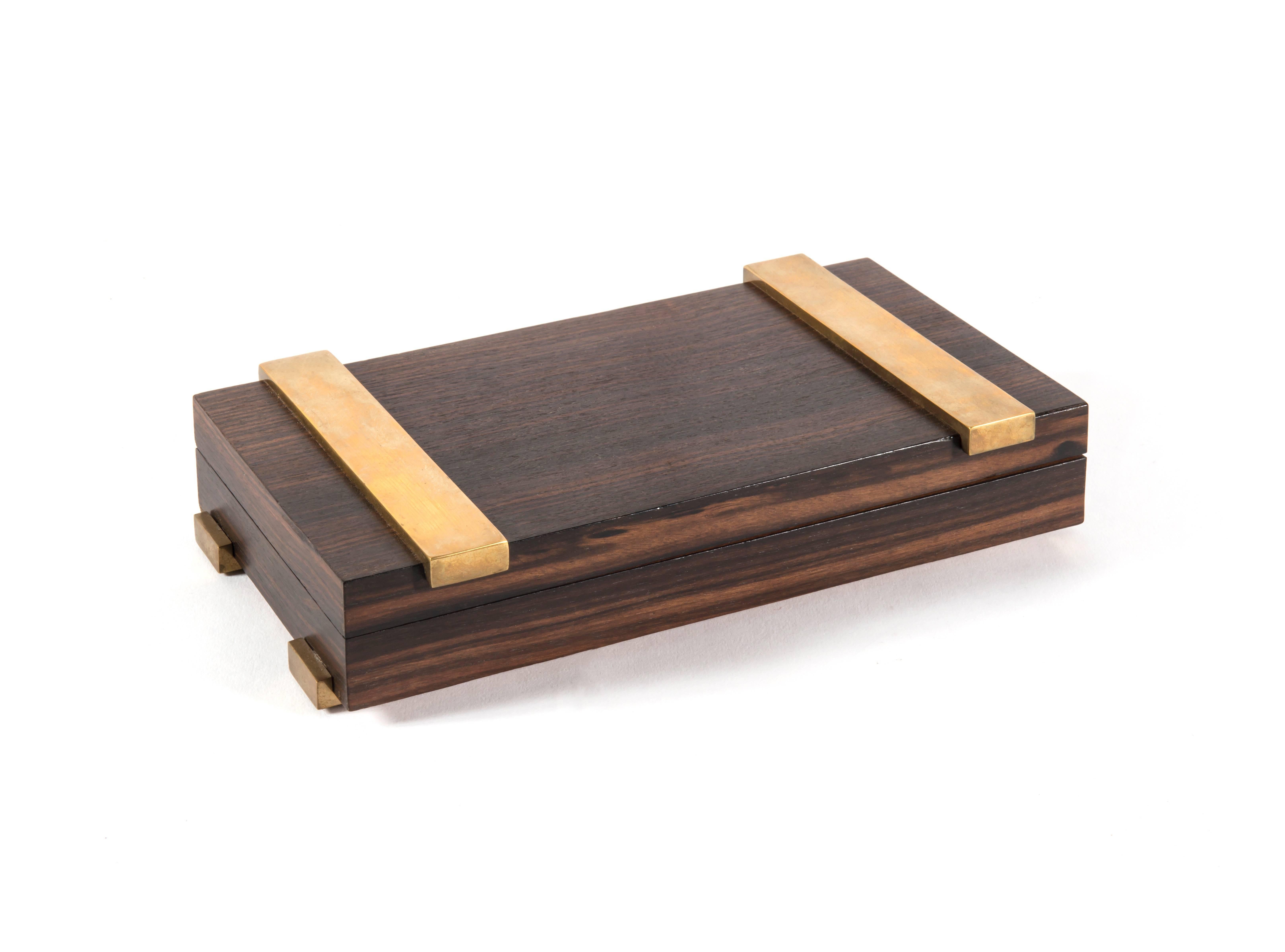 Cigarette box in Macassar ebony veneer and brass. Stamped with 
