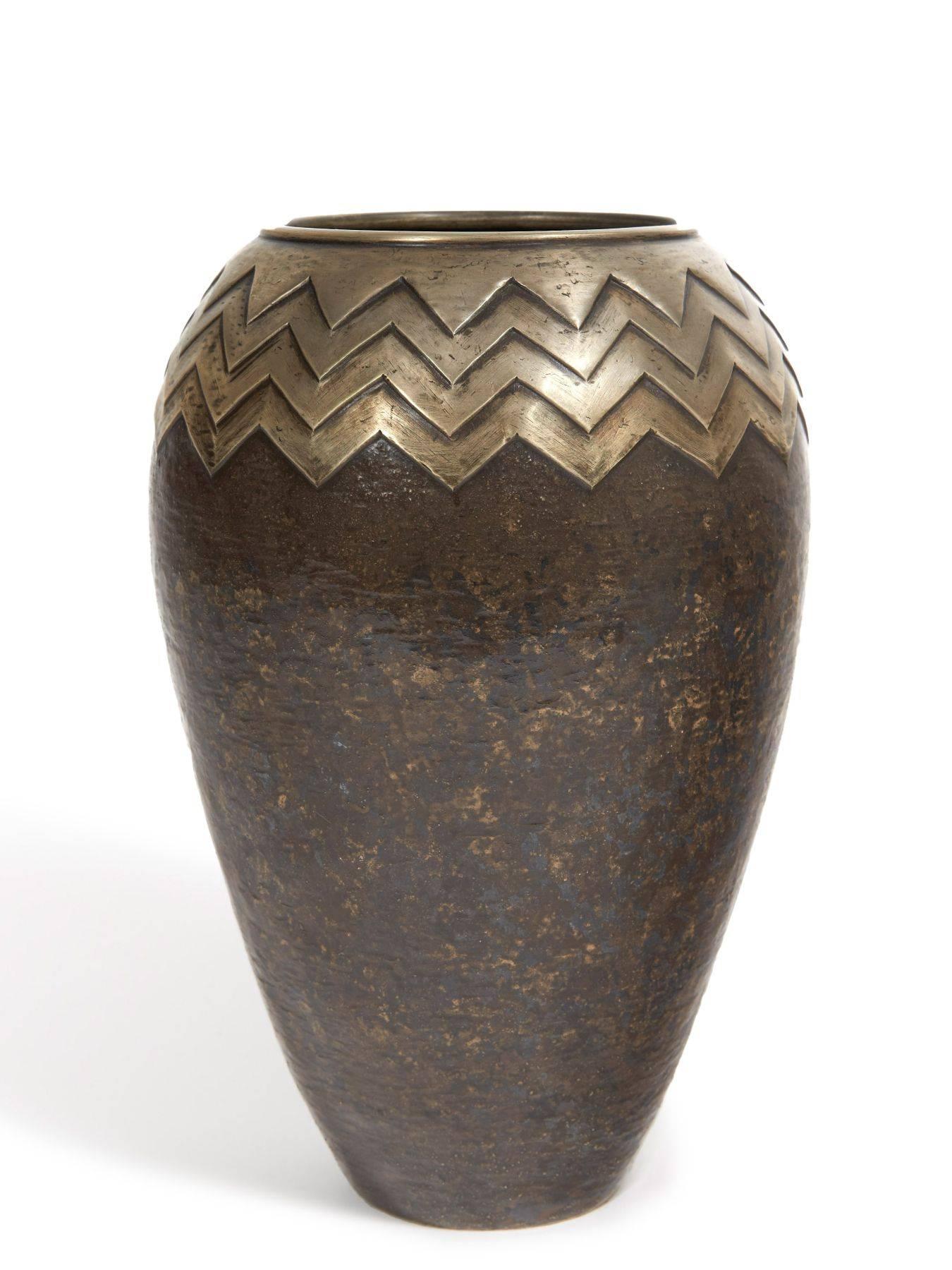 A copper Dinanderie vase with herringbone pattern.
Signed CL-Linossier under the base.