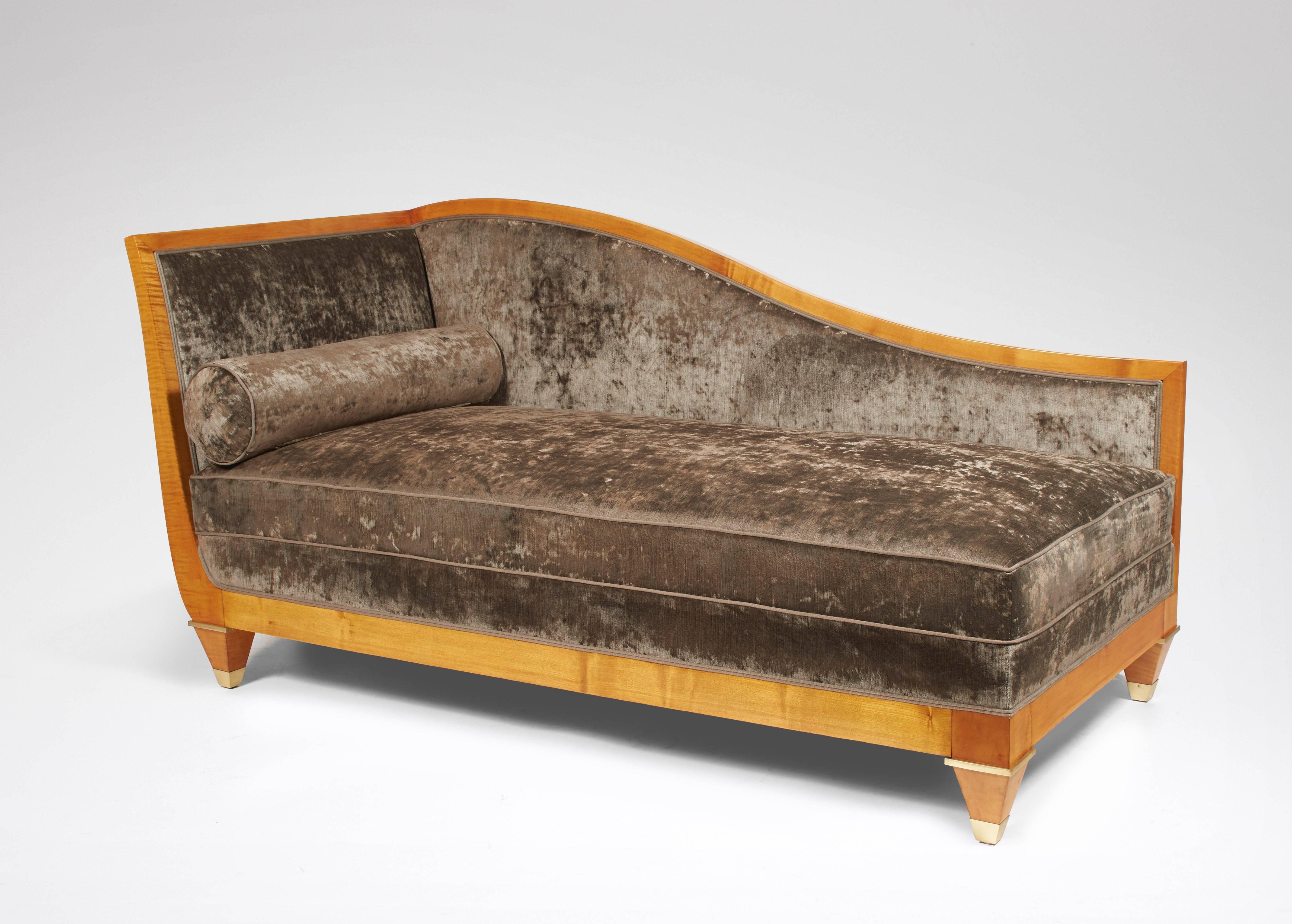 Sofa-bed in cherrywood, the bedsides slightly spilled and curved planks, sheathed foot with gilded metal rings, covered with taupe velvet.