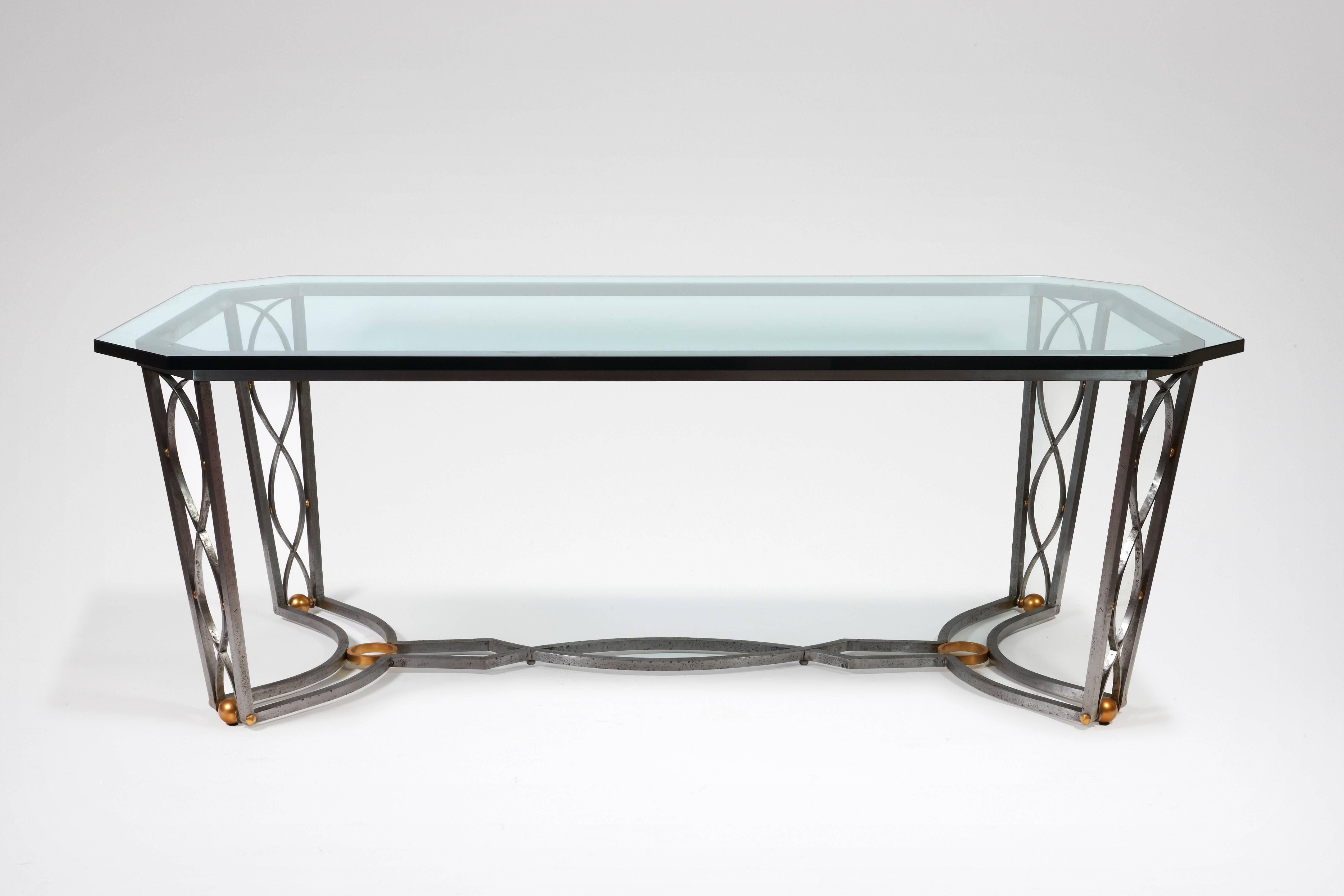 Dining room table in wrought iron and glass.

- Félix Marcilhac, 