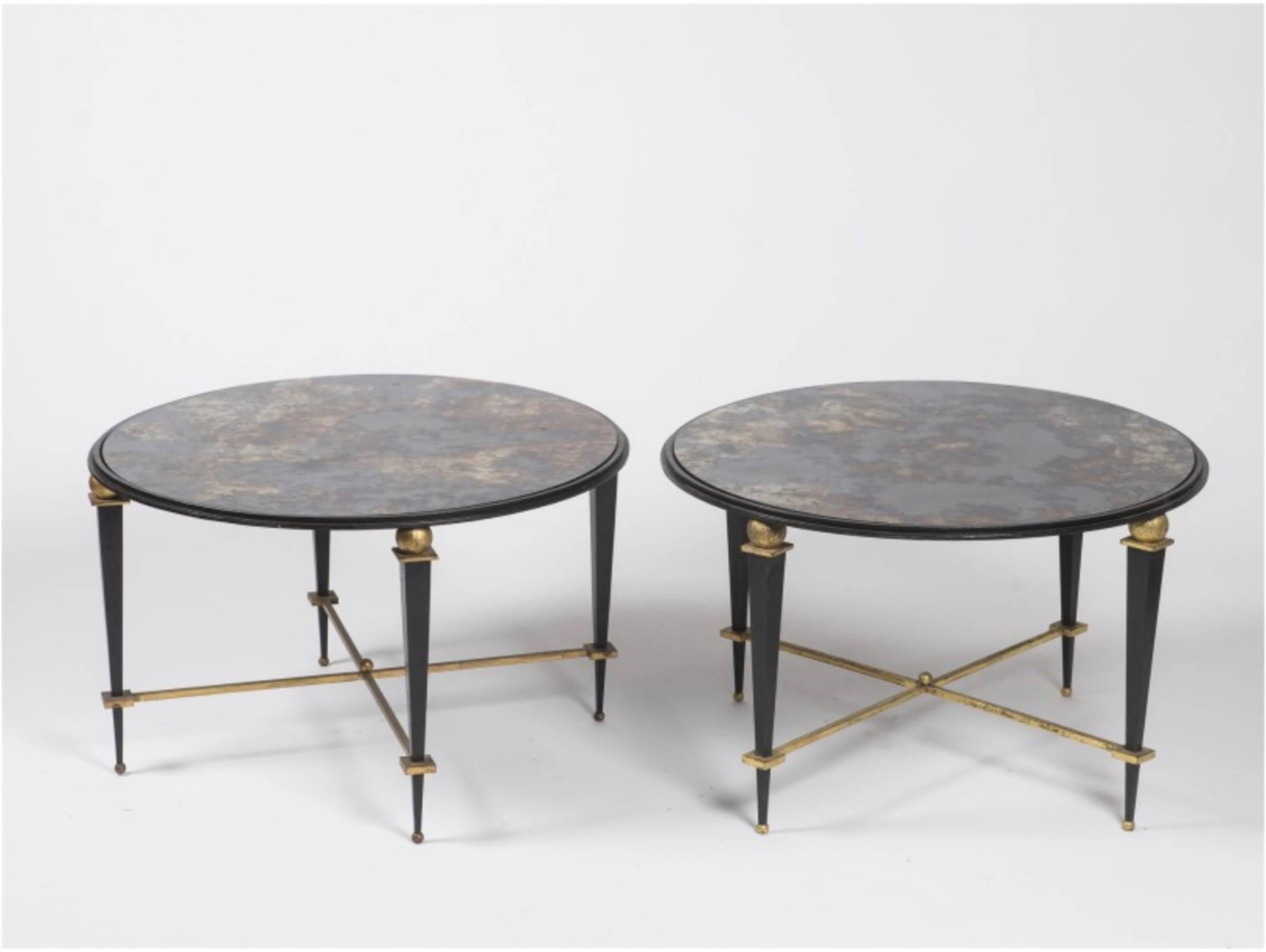 Pedestal table by Jules Leleu, circa 1940.
Wrought iron frame, partly gold leaf gilding, circular top called Turquin, in speckled red glass. Tripod legs united by an "X" spacer, decorated with a ball in its central part.