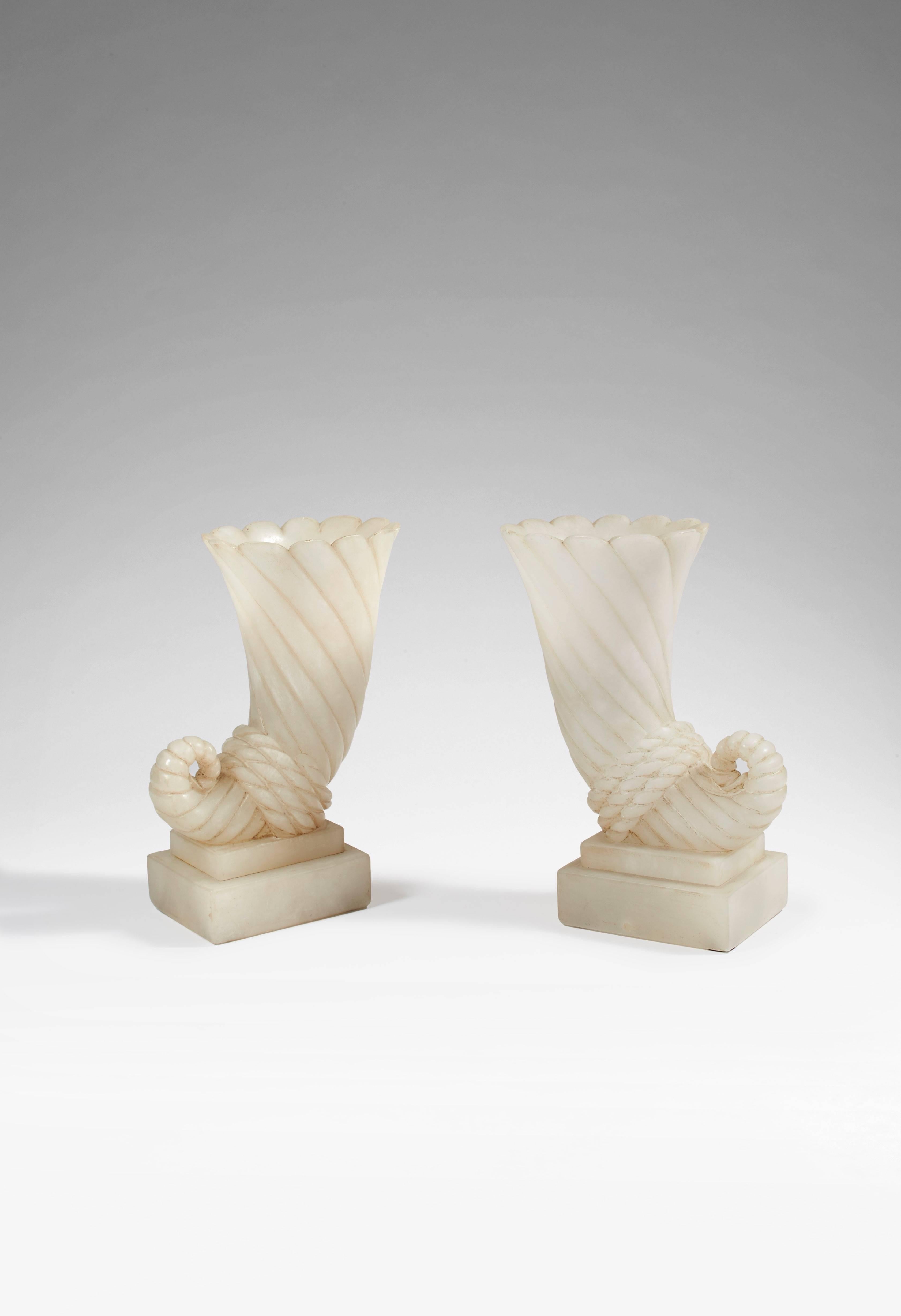 A Pair of alabaster enlightening vases.

- Revue Plaisir de France, 1935.