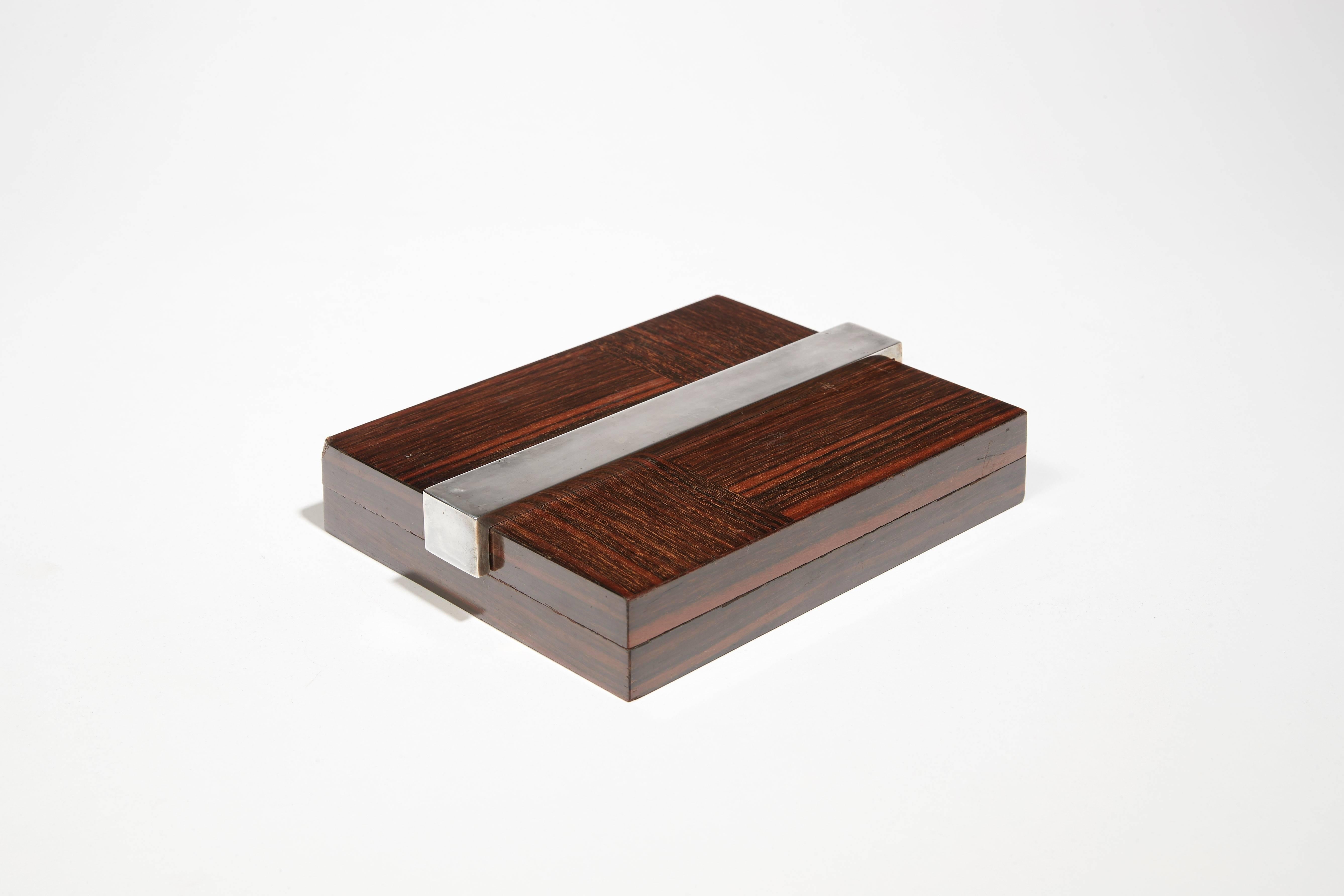 Box in wood veneer and silver nickel-plated metal. Stamped with 