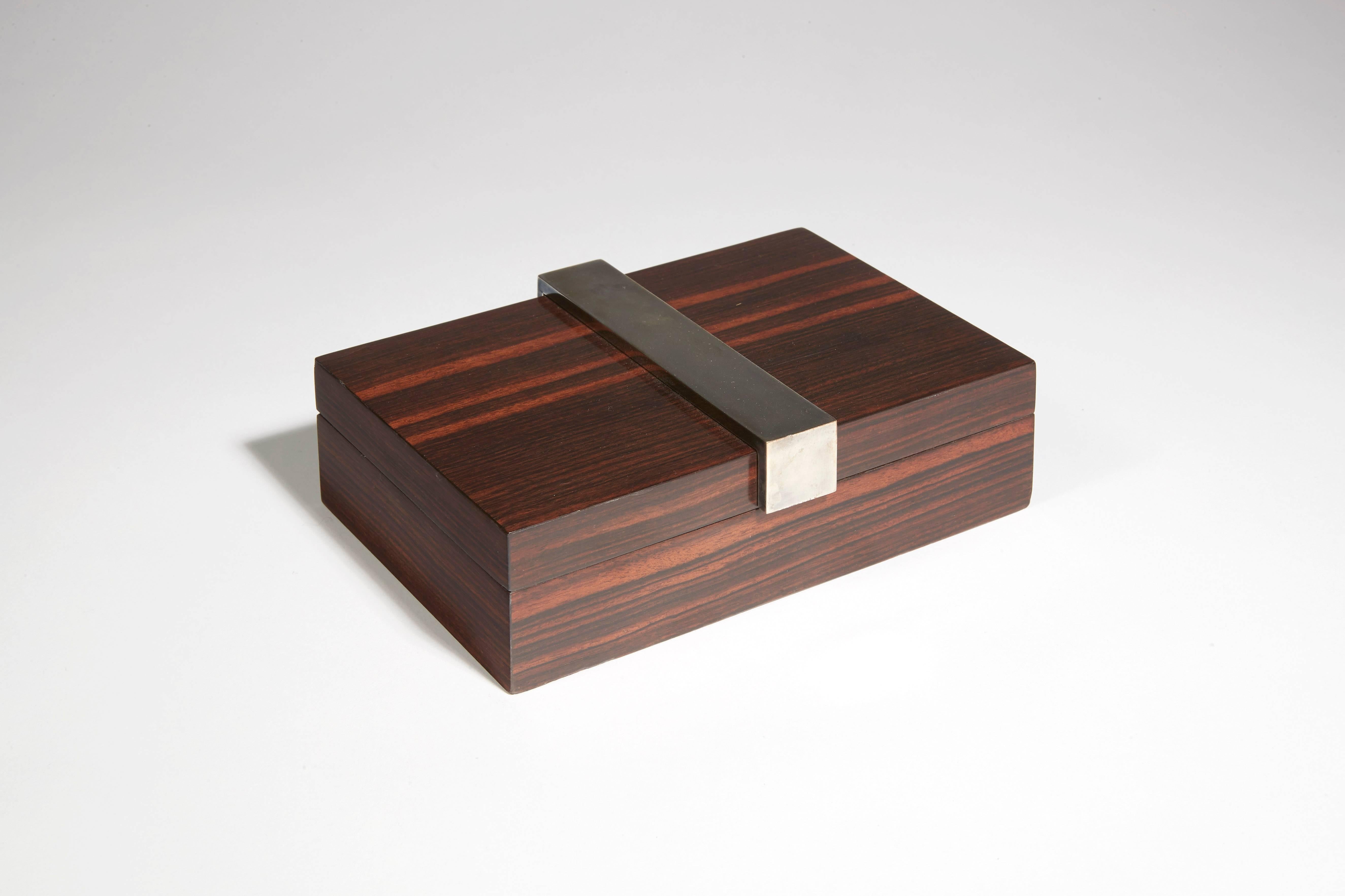 Box in wood veneer and silver nickel-plated metal. Stamped with 
