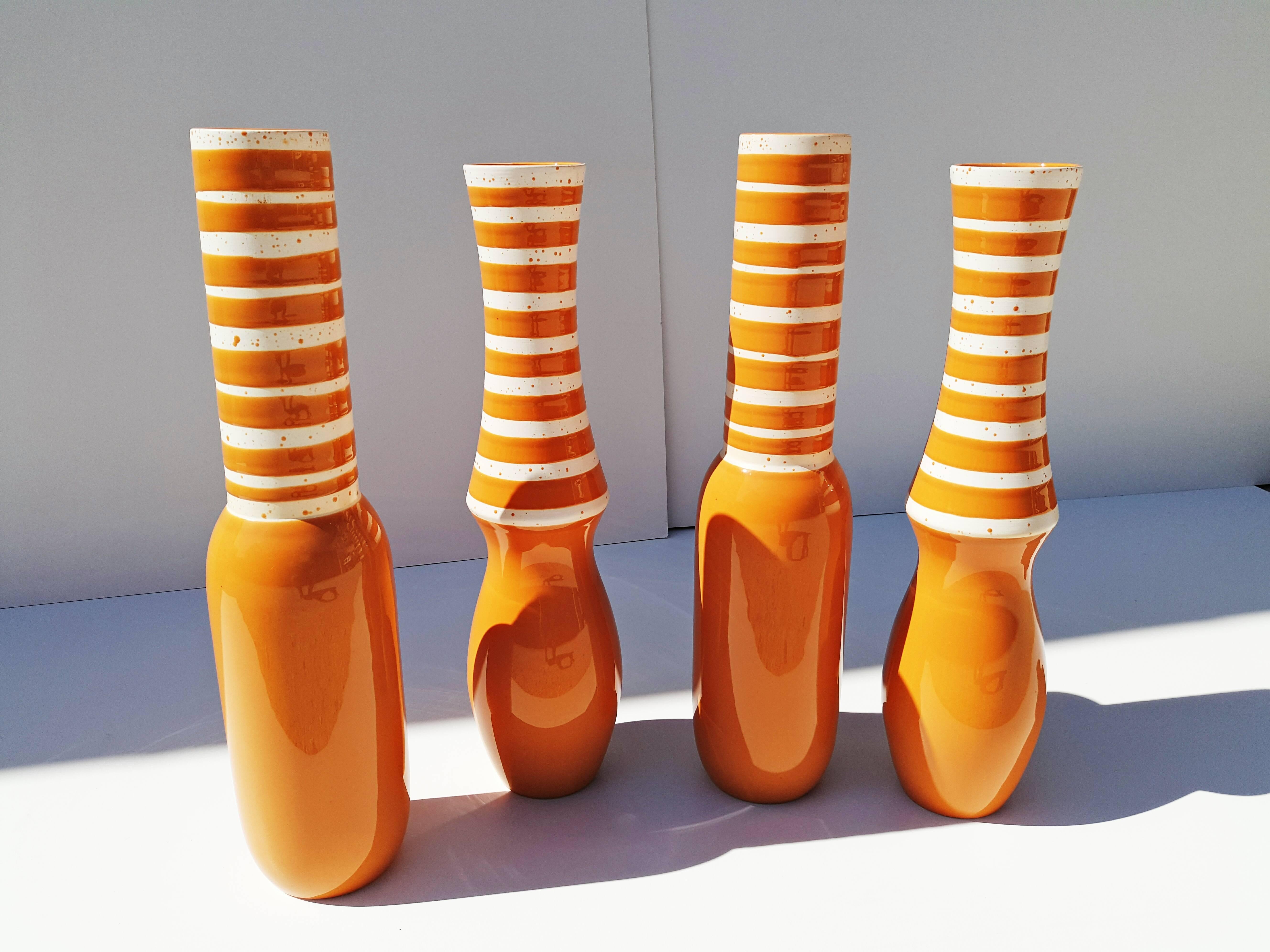 Rare set of four large Danish ceramics, in a beautiful orange with white circle on the top. Two different way shaped keel.
Height: 52 cm.