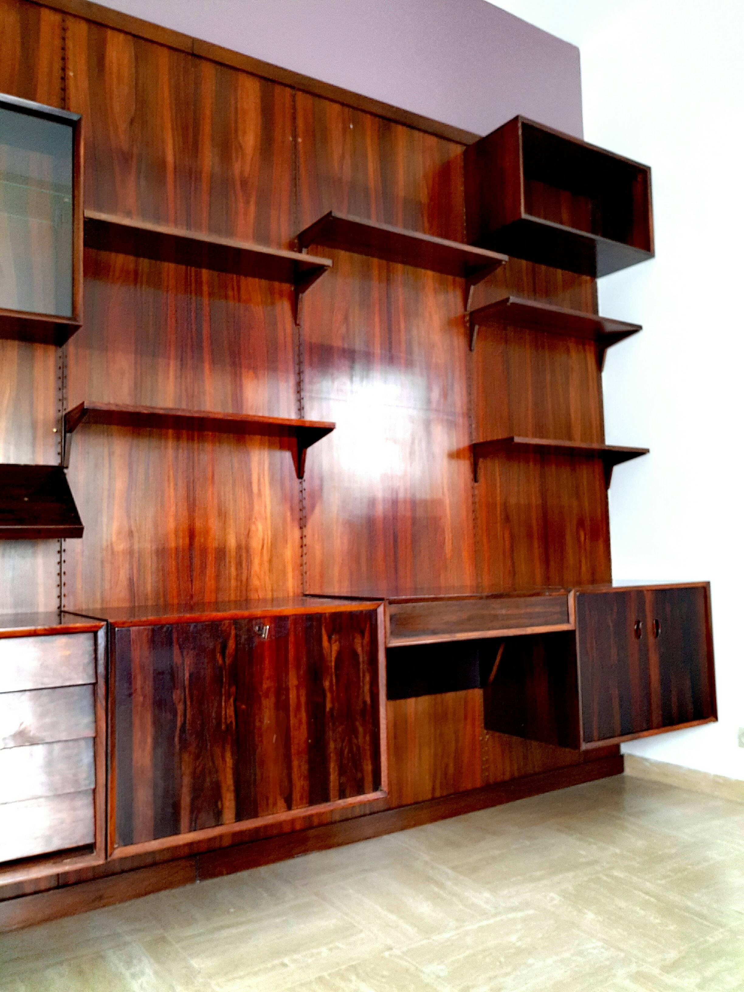 Large wall unit, shelving system by Cado, Denmark designed by Poul Cadovius in 1958. This modern shelving systems is made in really high quality of rosewood (Rio palisander). The system allows arranging multiple configurations. The following part