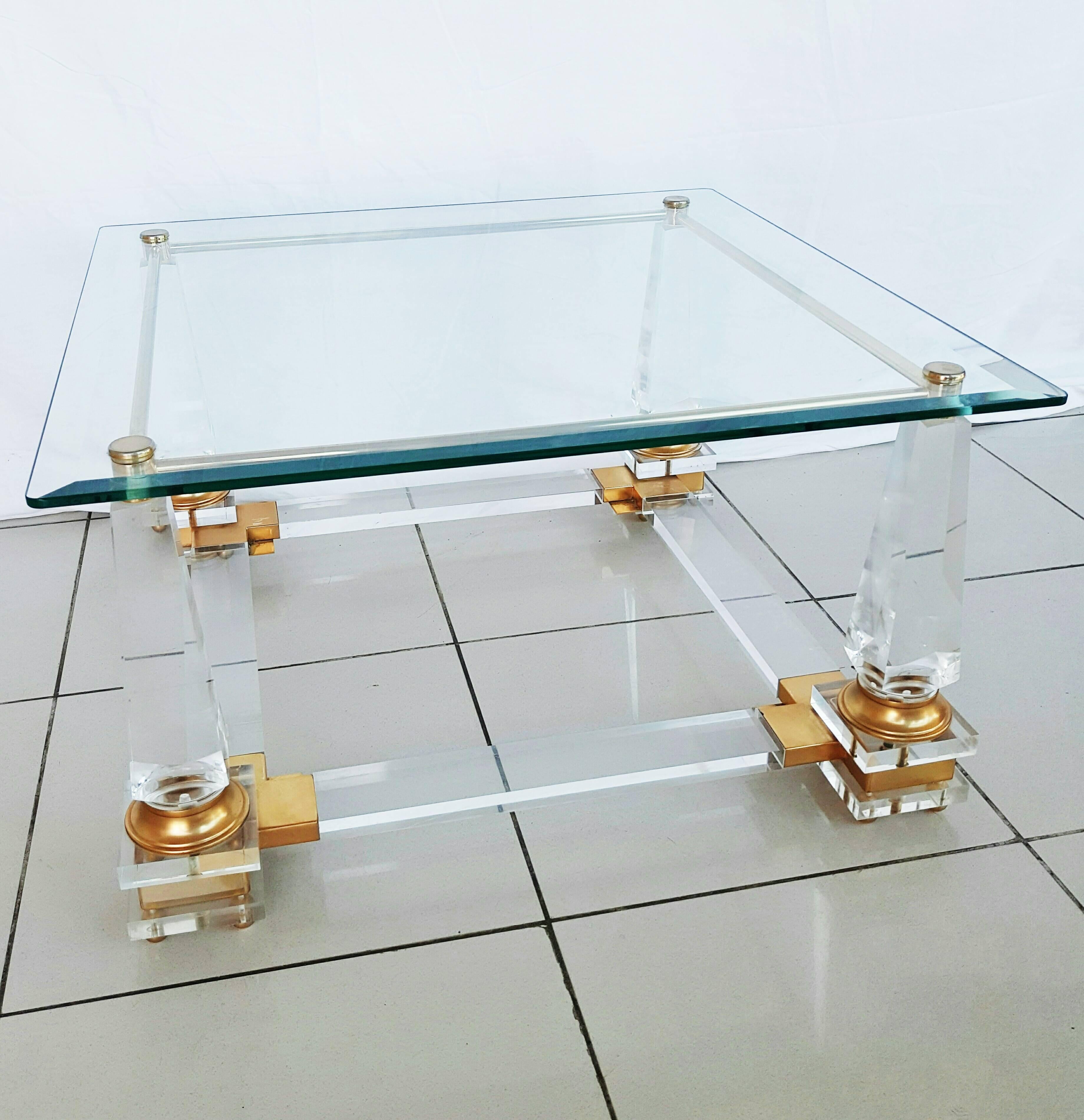 Beautiful French coffee table in the style of Maison Jansen, 1970s.
Brass, Lucite and glass, in perfect vintage condition.