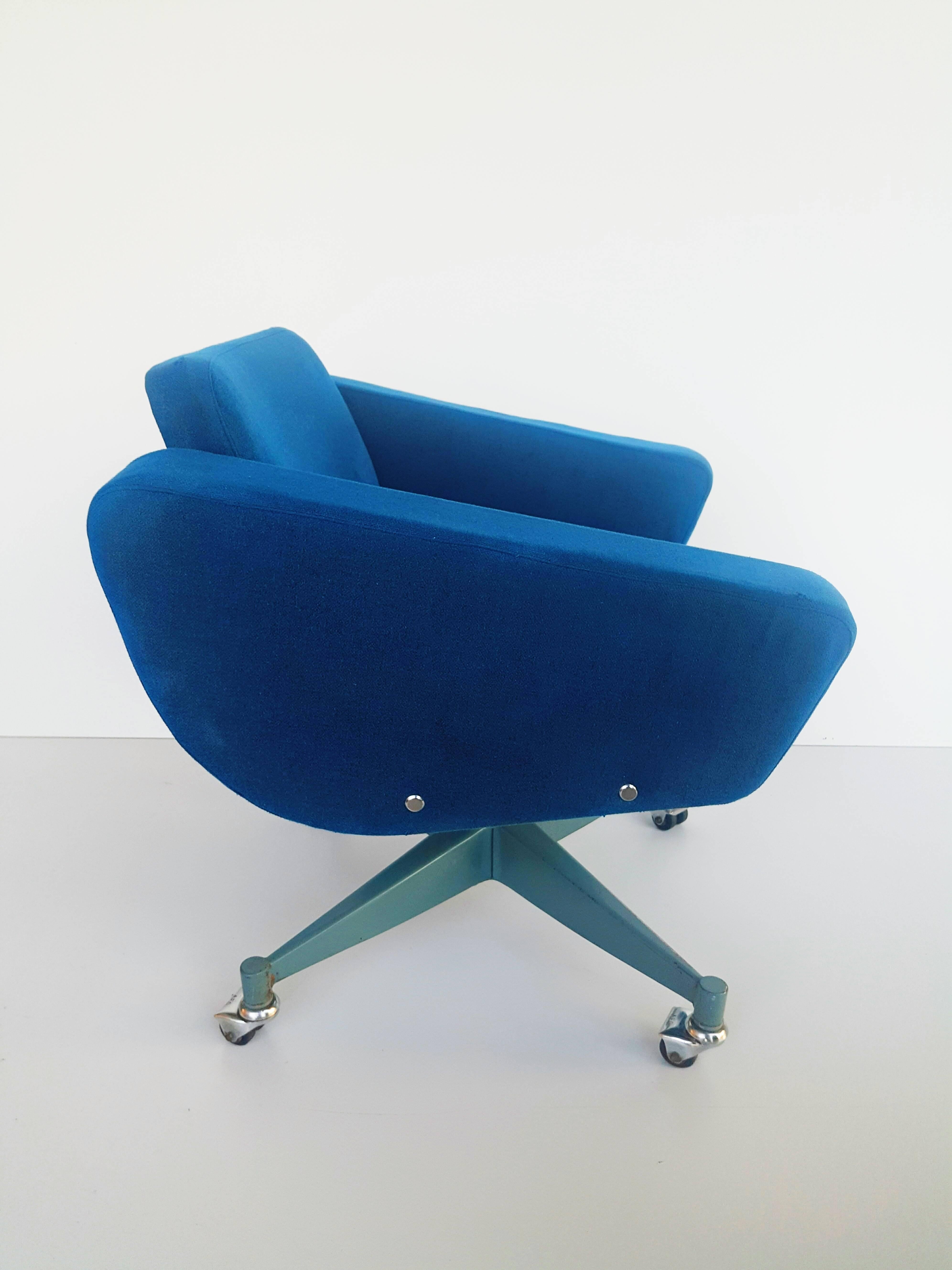 Rare and beautiful armchair by Vives, Spain, 1970s. In original blue oil fabric, with metal star leg on double wheels.