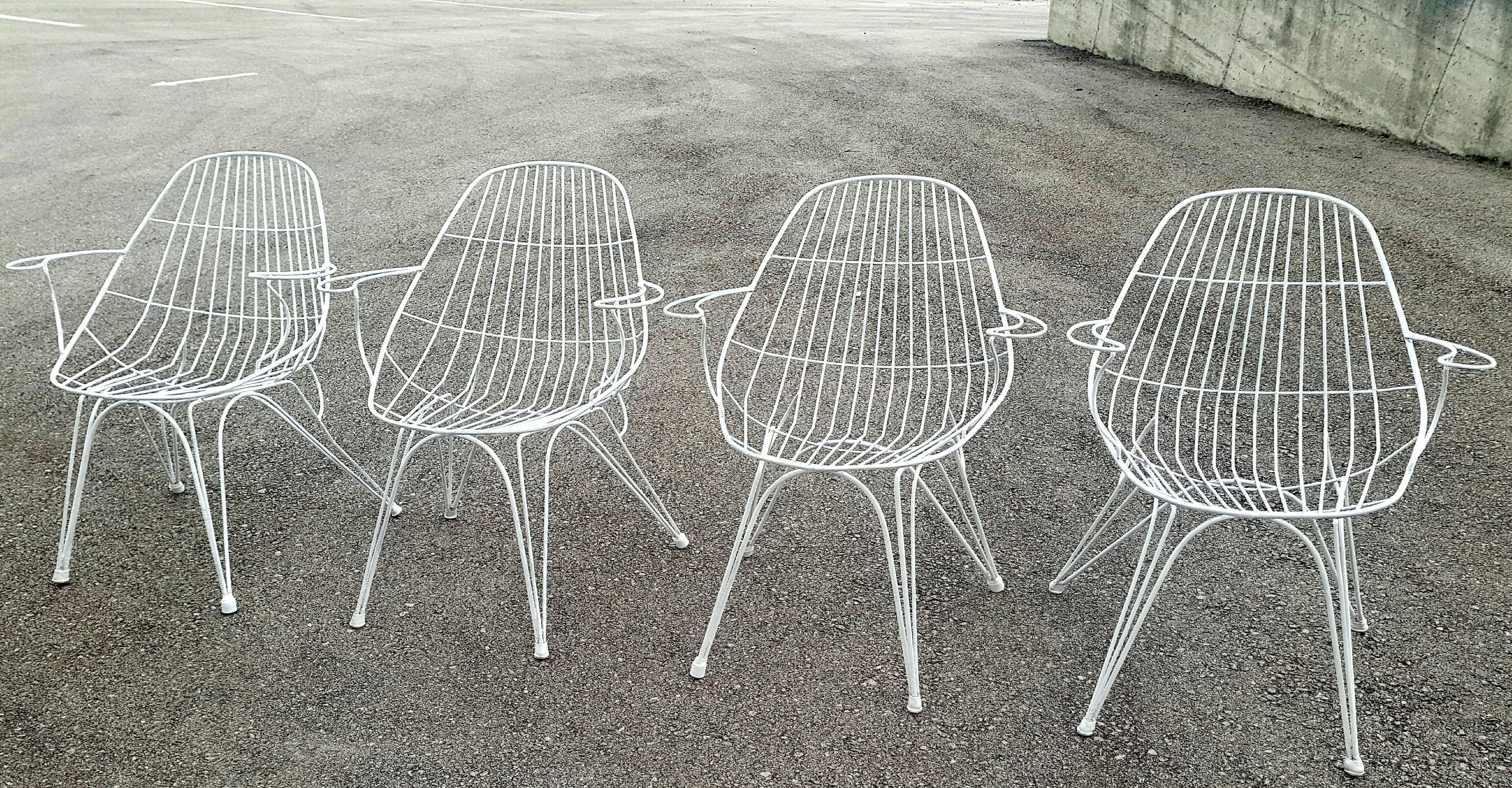 Beautiful and rare set of four Italian iron armchairs, circa 1950. In perfect vintage condition.