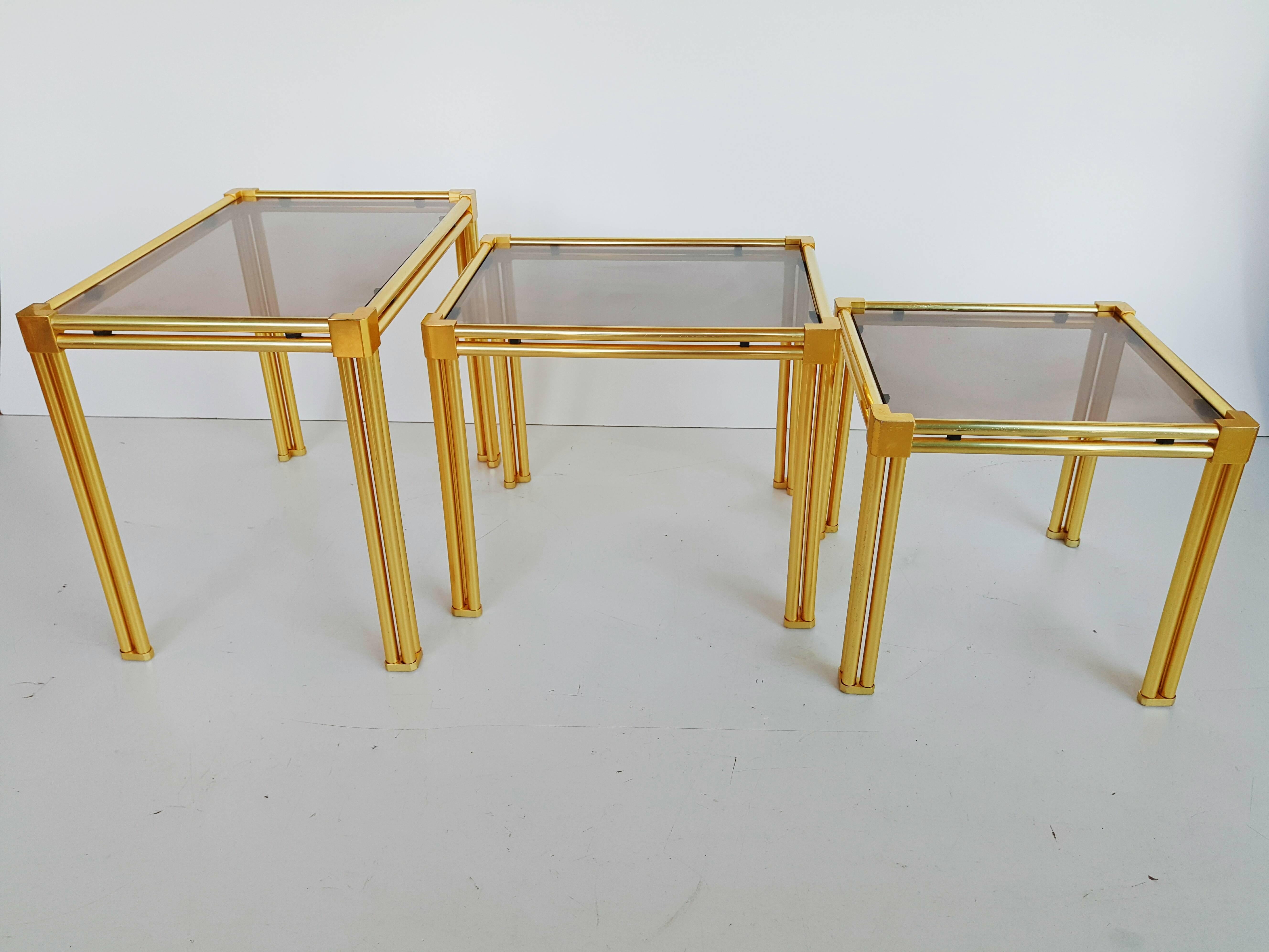 French Brass and Smoked Glass Nesting Tables, 1970s In Excellent Condition For Sale In L'Escala, ES