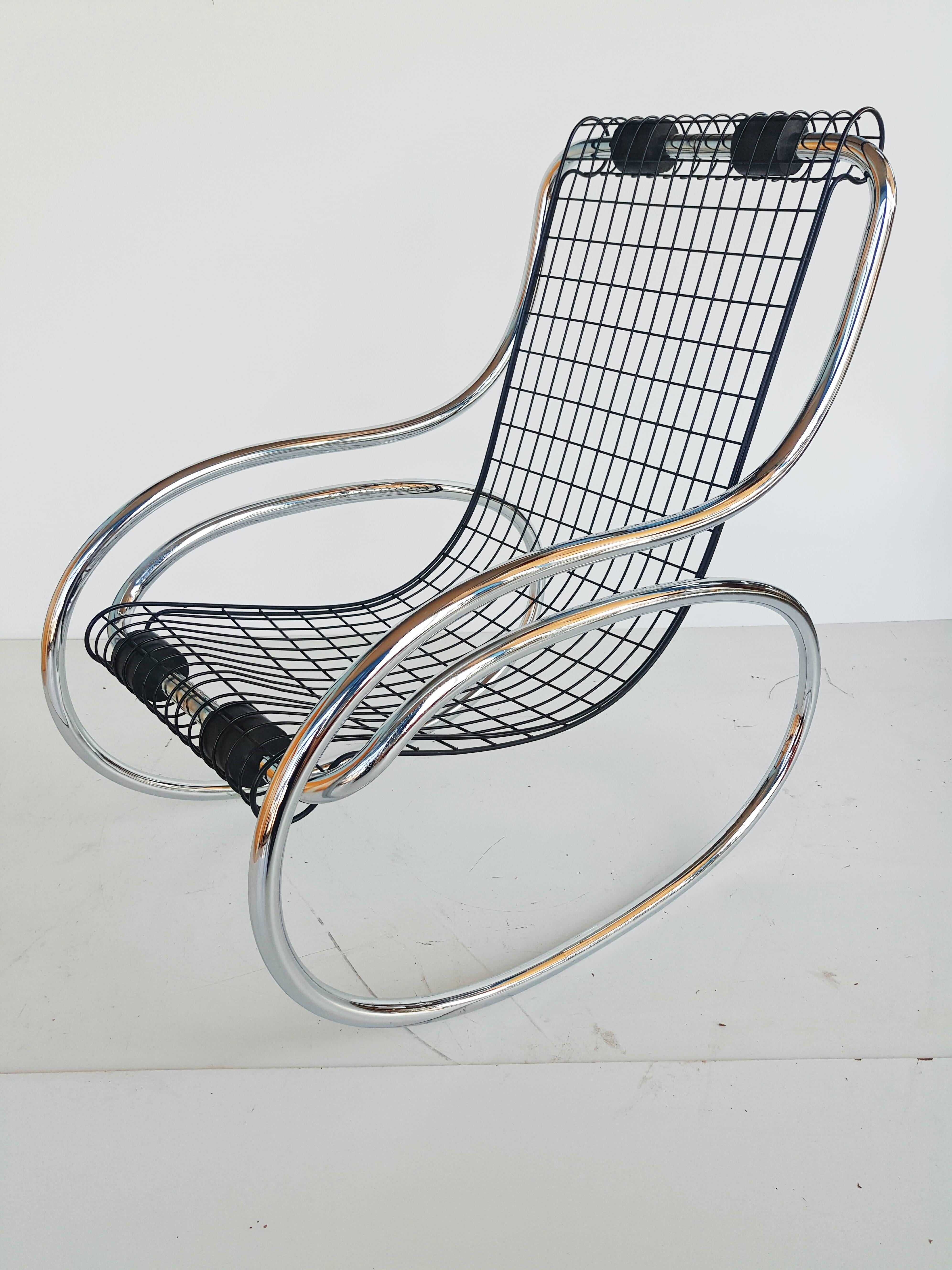 Beautiful and rare iron and chrome rocking-chair, manufactured in 1970, in perfect vintage condition.