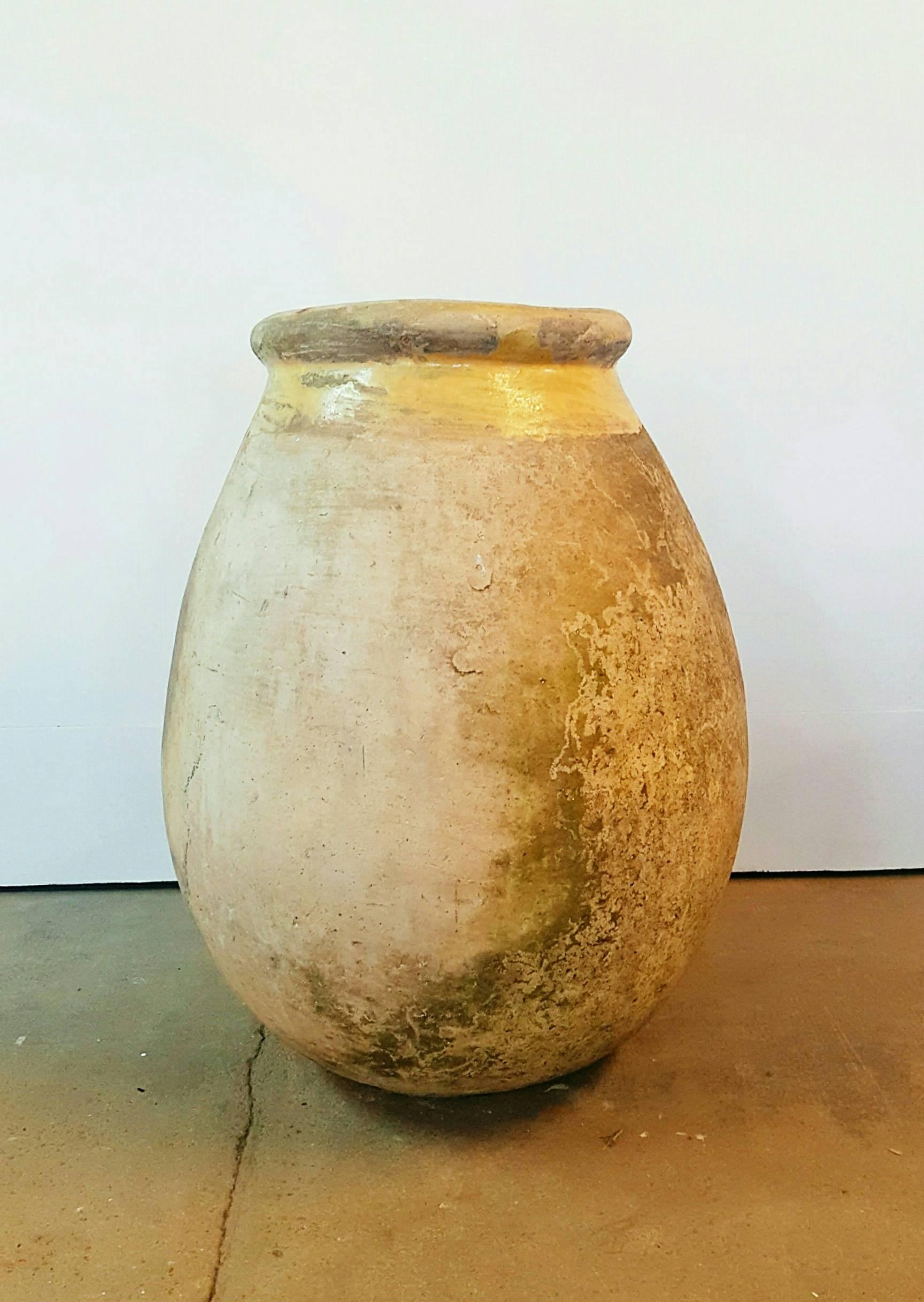 A French Provincial Biot jar from the 18th century, made of terracotta with a yellow glazed rim. Biot is a small village located in the center of the Côte d'Azur, between Nice and Cannes and is often considered a paradise for the French art de
