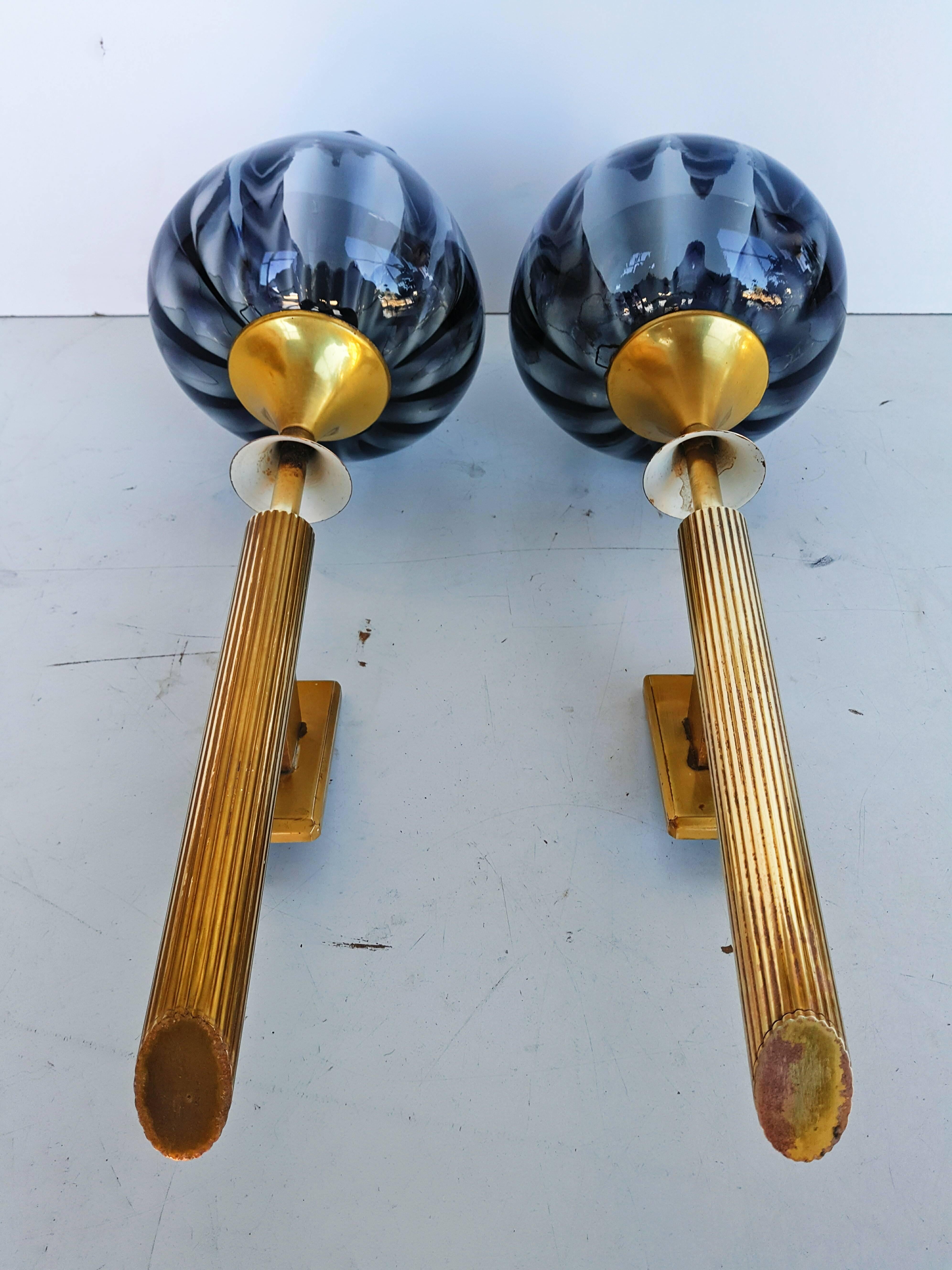Beautiful and rare in this size pair of French brass sconces with smoked Murano glasses, manufactured in 1960s. In very good vintage condition.