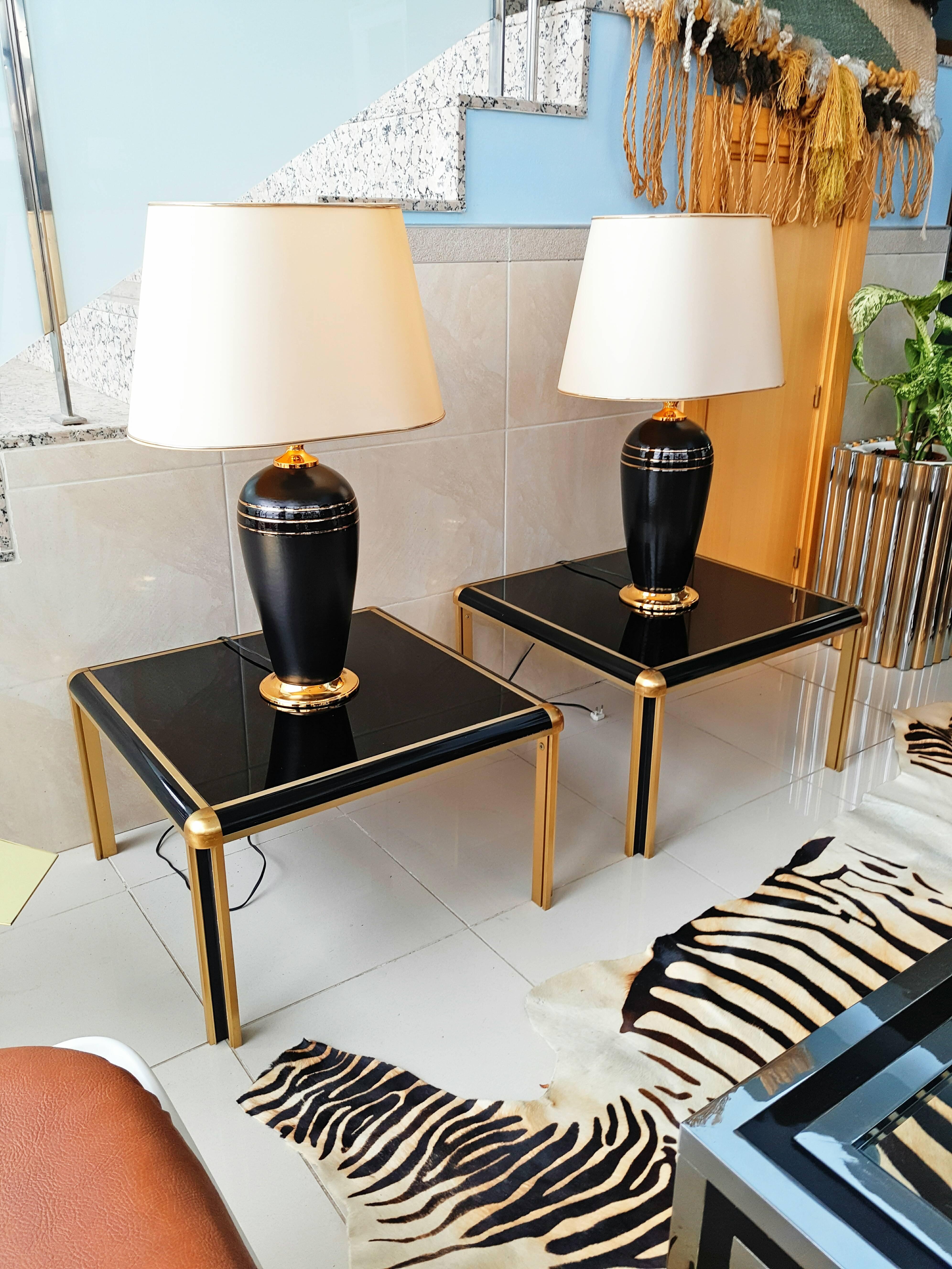 Beautiful and rare pair of brass and glass end tables manufactured in France. In very good vintage condition.