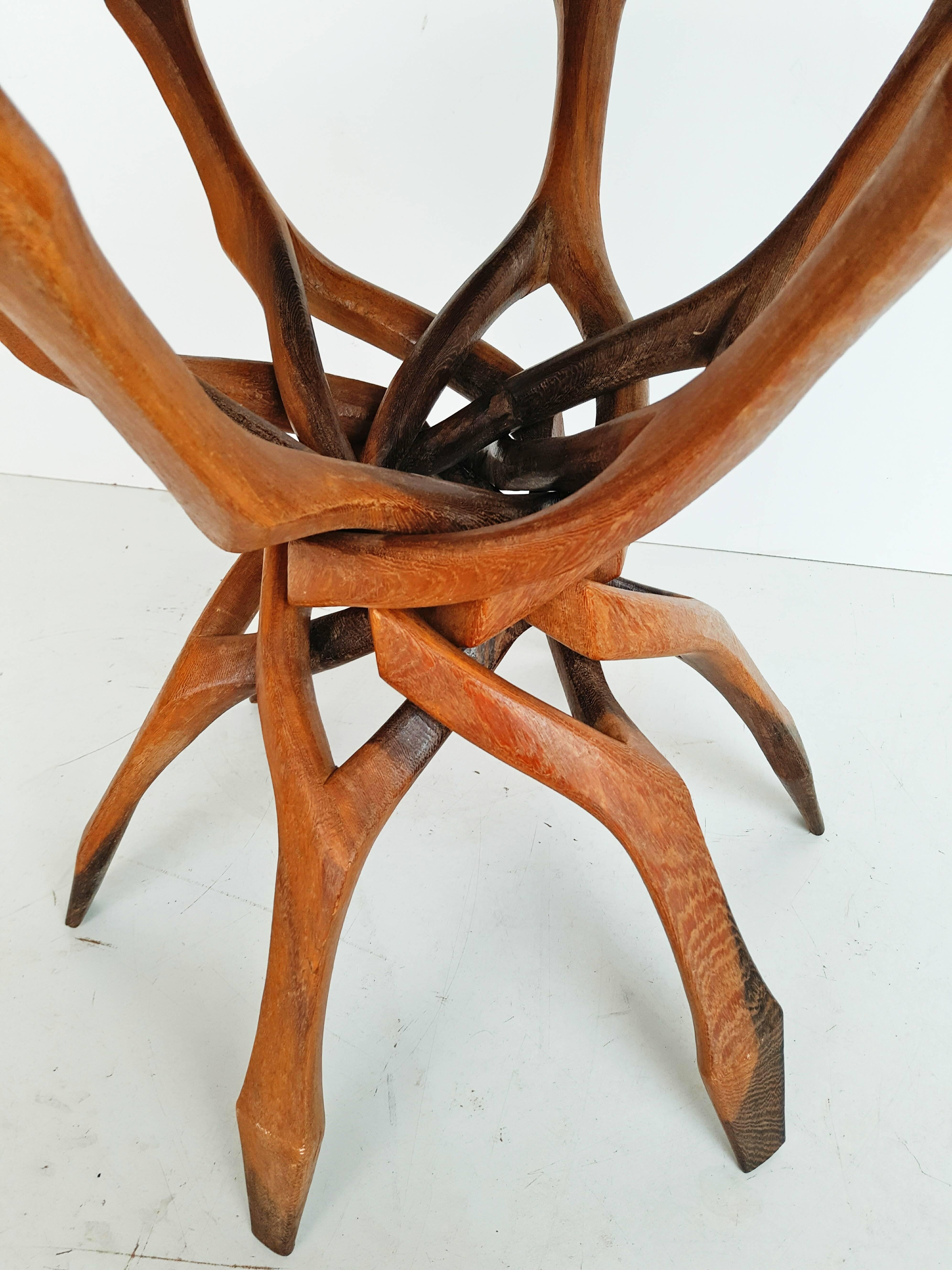 Very rare organic end table in teak circa 1960, incredible hand made work, carved from a single piece of wood. An exemplary production this table is very stable.