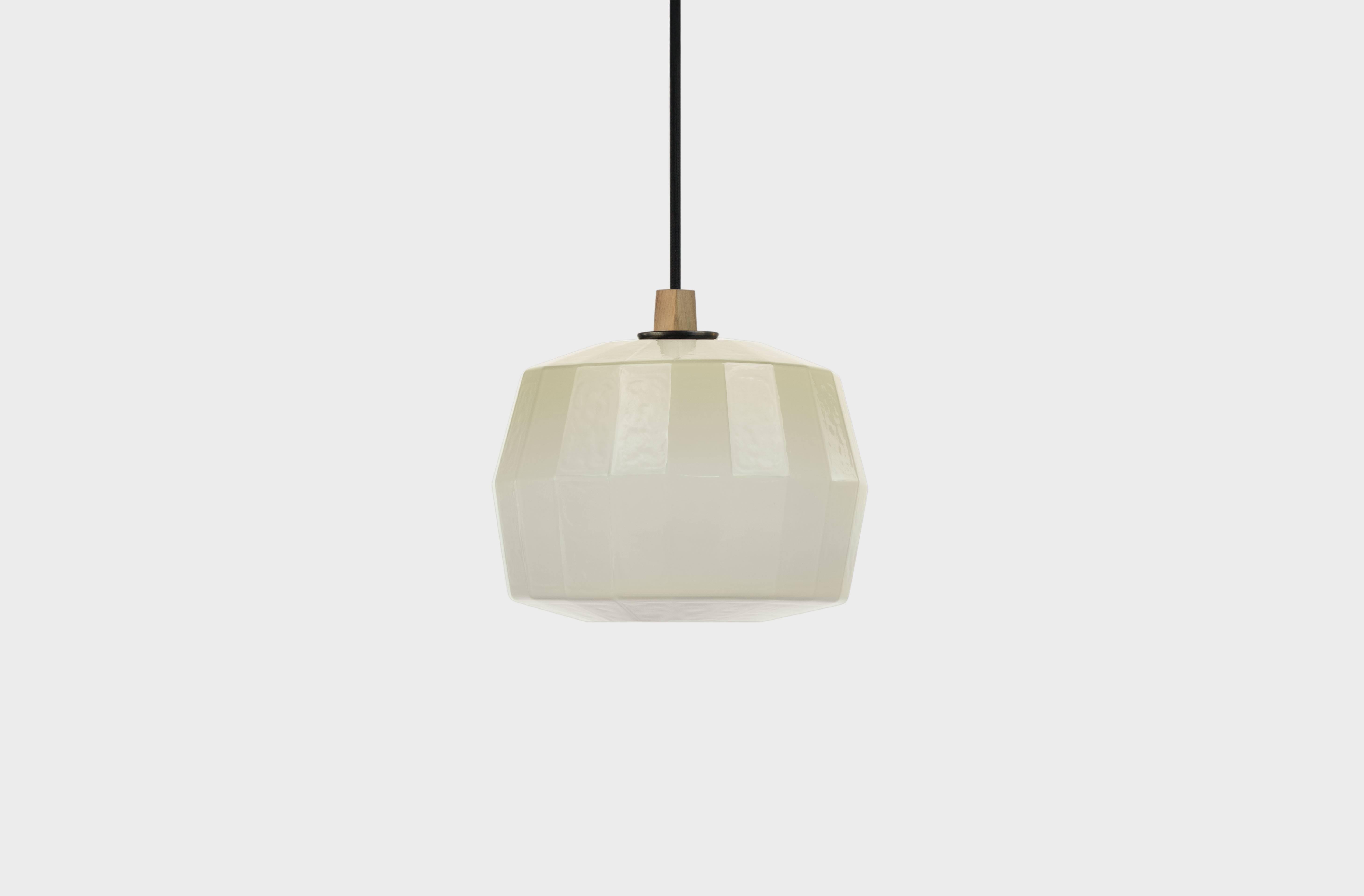 Votta - 8”H x 9.5”L x 9.5”W is available in 7 colors.

The Poly Pop Pendant Collection gives geometrically ridged architectural structure to common organic forms. Drawing inspiration from Art Deco and early Modernist lighting and decorative