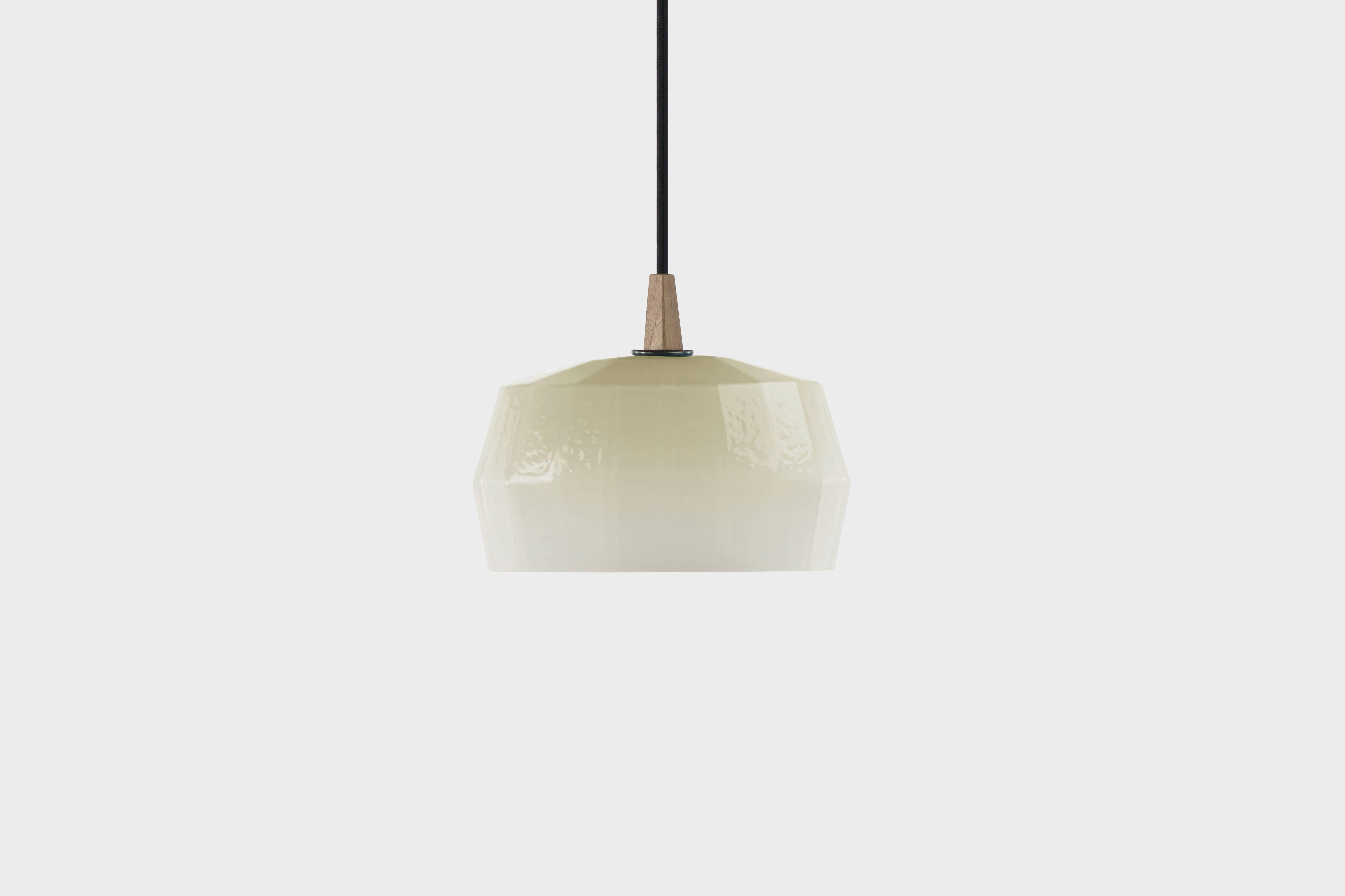 ZEP - 7.5” H x 9” L x 4.5” W available in 7 colors cream, caramel, lagoon, ruby, sky (shown), slate and tourmaline.

The Poly Pop pendant collection gives geometrically ridged architectural structure to common organic forms. Drawing inspiration