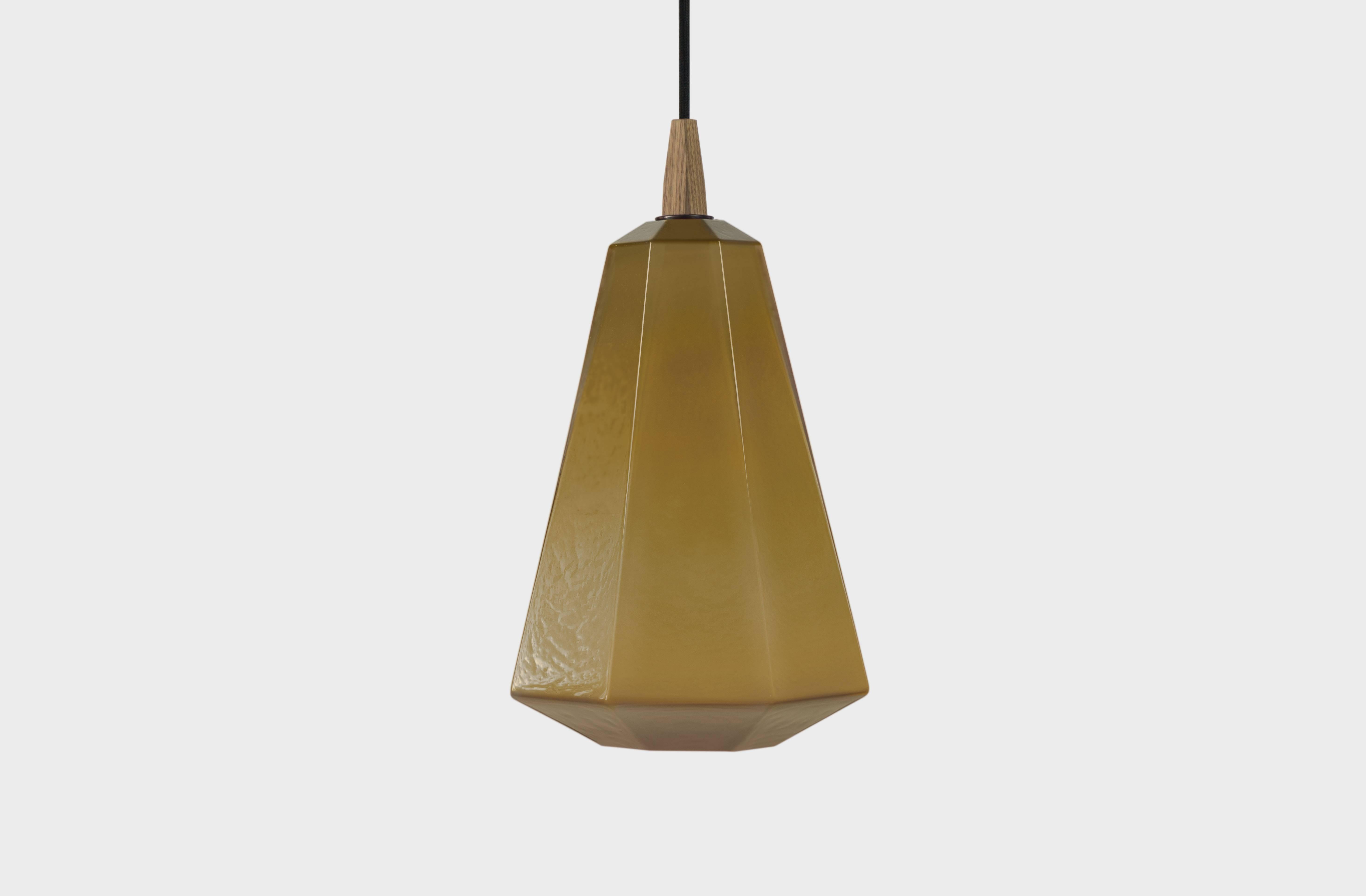 PRIM - 16.5” H x 9” L x 9” W available in six colors. Cream, caramel, lagoon, ruby, sky, slate and tourmaline. 

The Poly Pop Pendant Collection gives geometrically ridged architectural structure to common organic forms. Drawing inspiration from