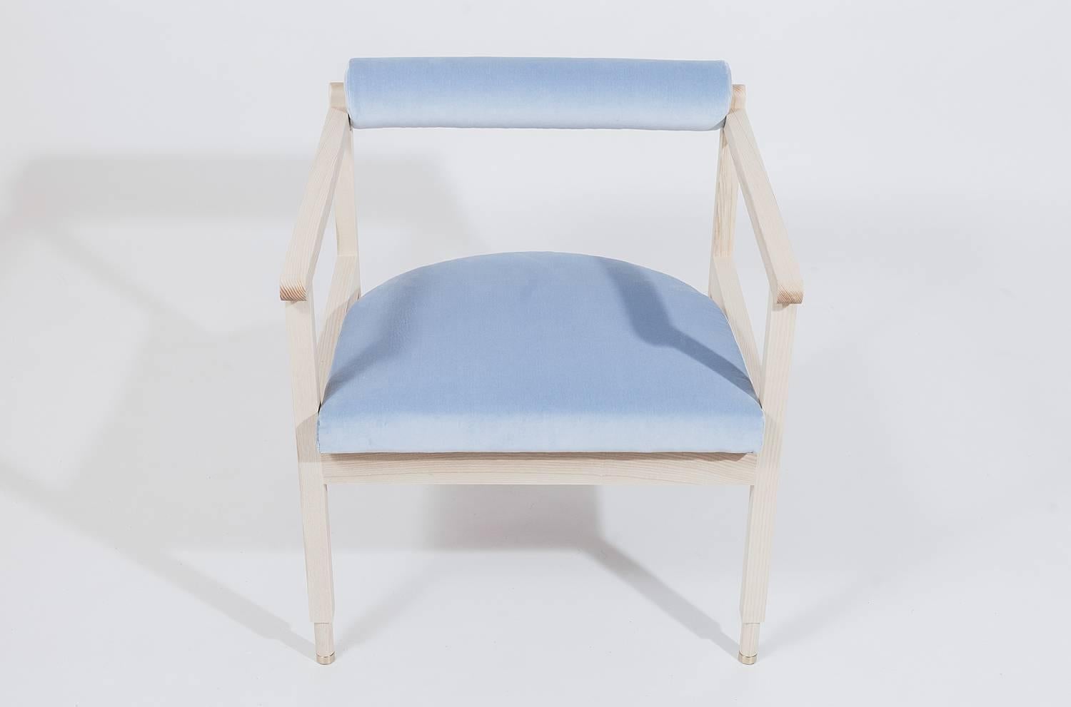 As shown:
Solid white oak with cerused finish and coral linen upholstery.
Solid bleached ash with light blue cotton upholstery fabric by Maharam or grey wool upholstery fabric by Kvadrat for Maharam.
Oil and wax or flat waterborne
