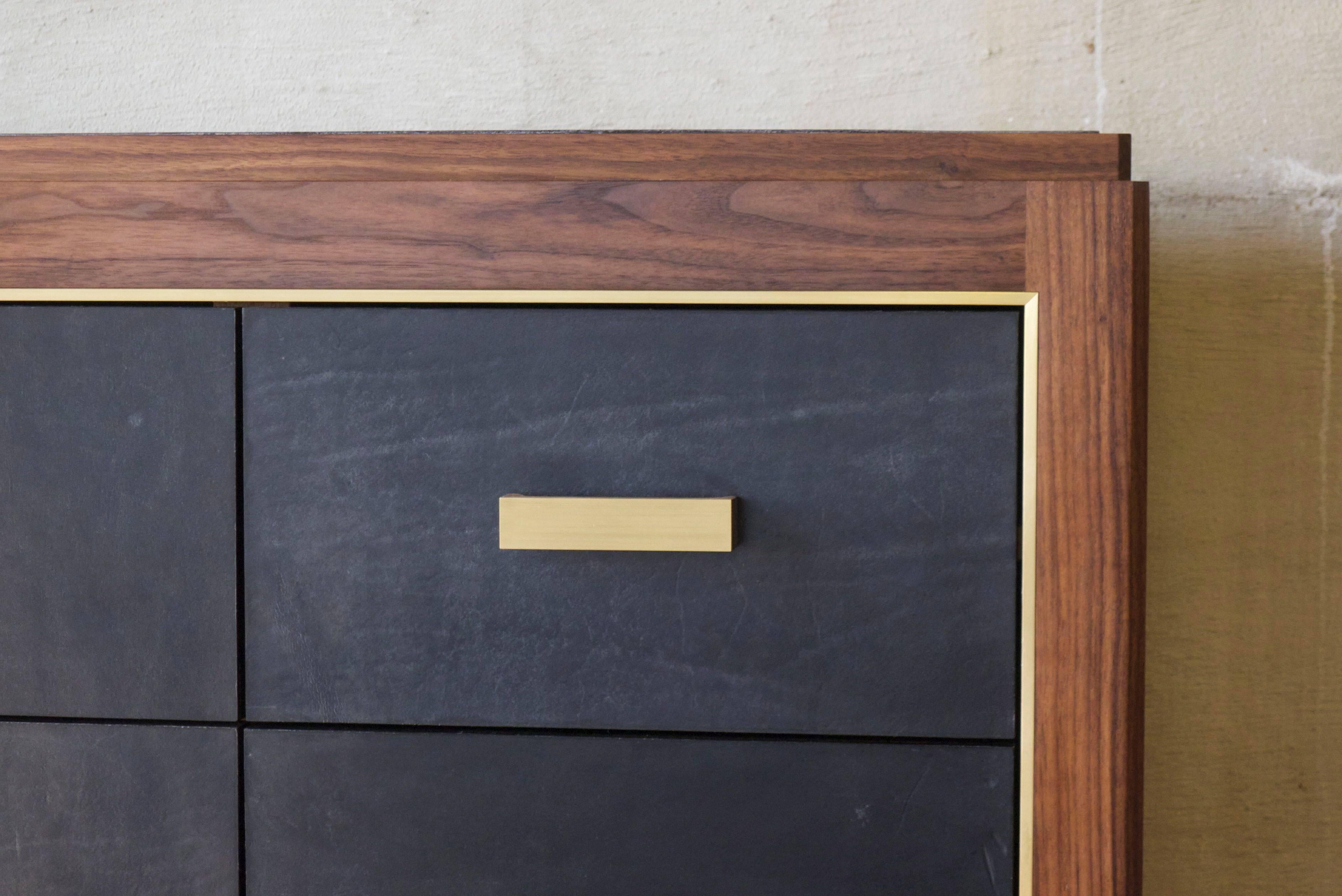 Inspired by Mid-Century Modern Mexican design, this 12-drawer bureau is made with solid walnut construction with hand-dyed saddle leather drawer faces and blotter. Saddle leather choices include natural, dark brown, black, jade or Aubergine