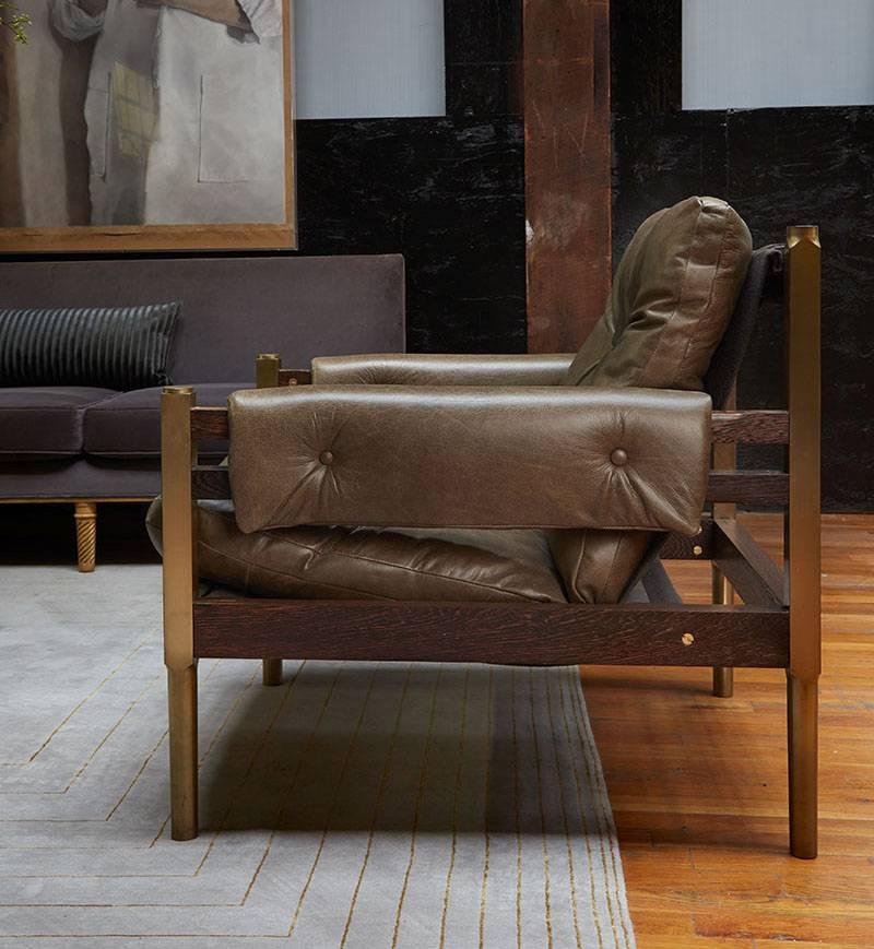 Inspired by Brazilian Mid-Century Modern and Campaign influences, this club chair is the ultimate in comfort. Brass legs, wenge construction, and choice of nine leathers included.

 