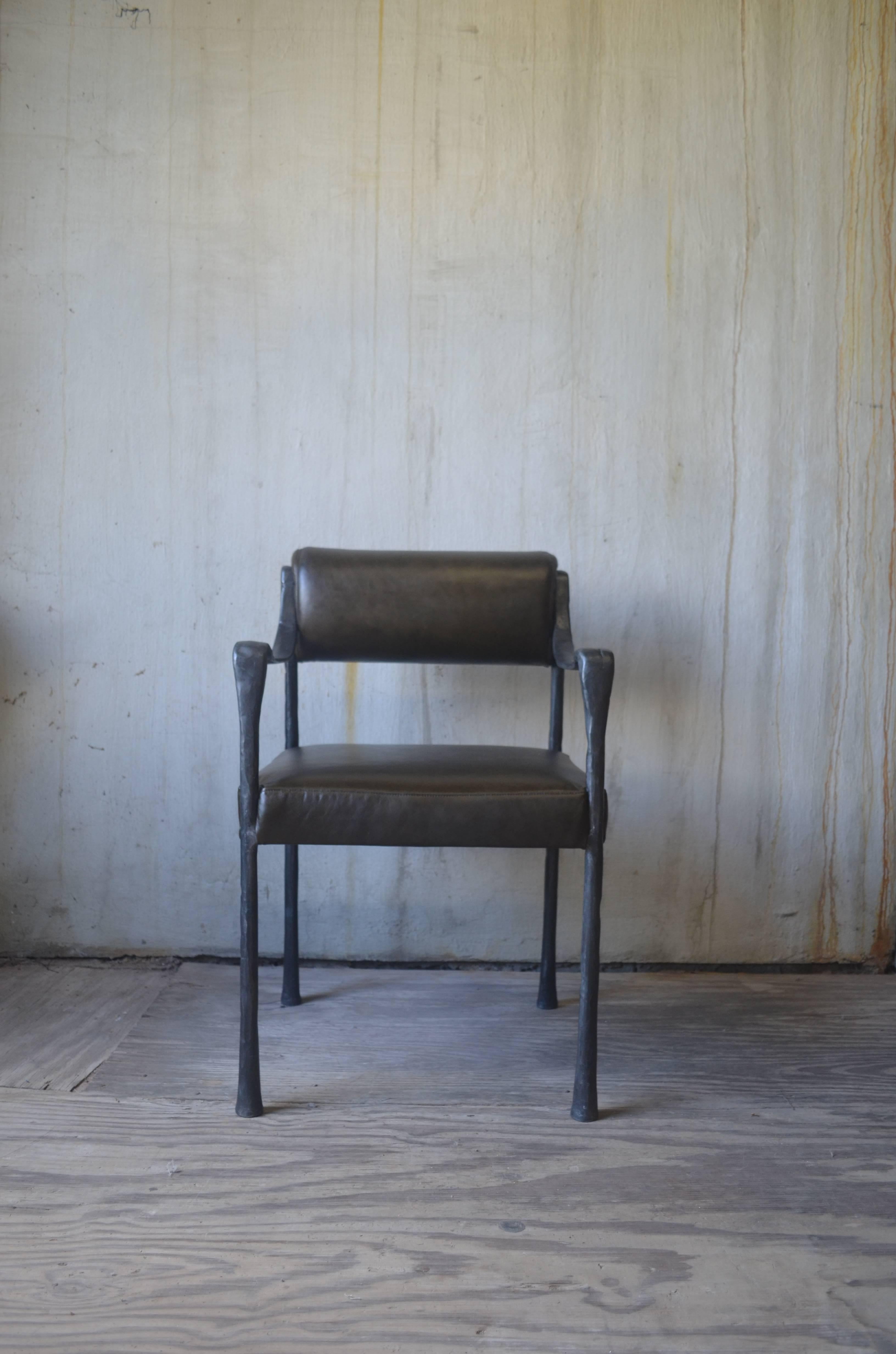 Cast metal frame makes for a sculptural side chair but the weight is also perfect for dining applications. 