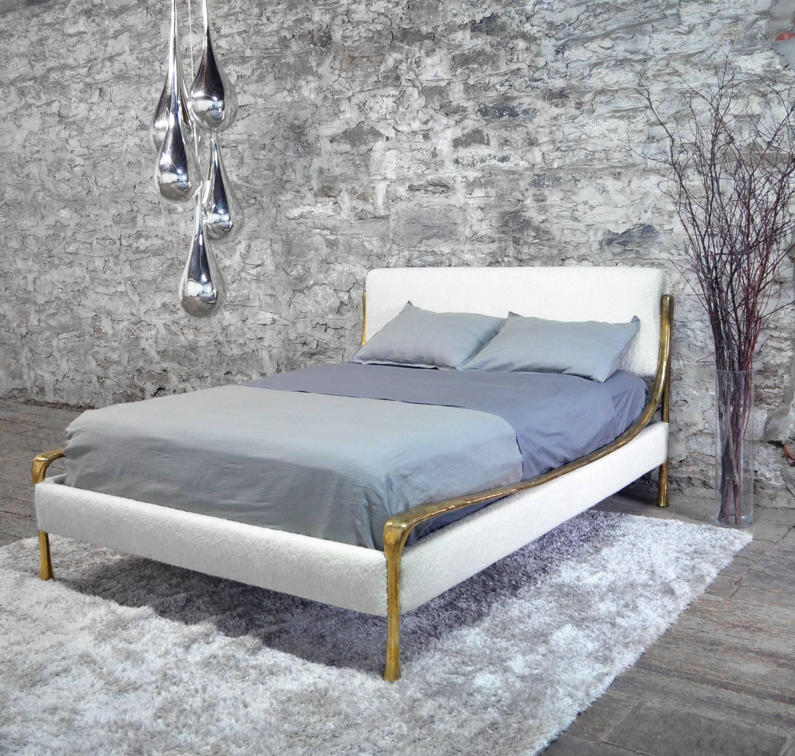 Hand-carved and cast silicone bronze frame with fabric or leather upholstered headboard and rails (COM/COL.) Frame finishes include bronze or white bronze. Each bed is customized to the specified mattress height.